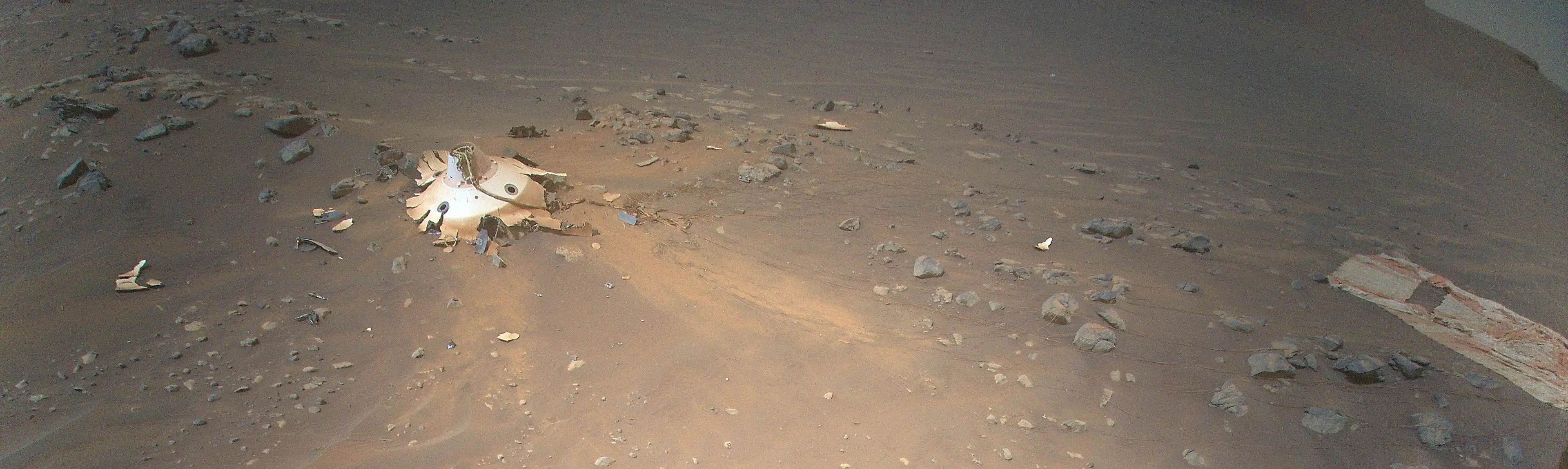 The parachute was still attached when it hit Mars' surface at 78mph (NASA / JPL-Caltech)