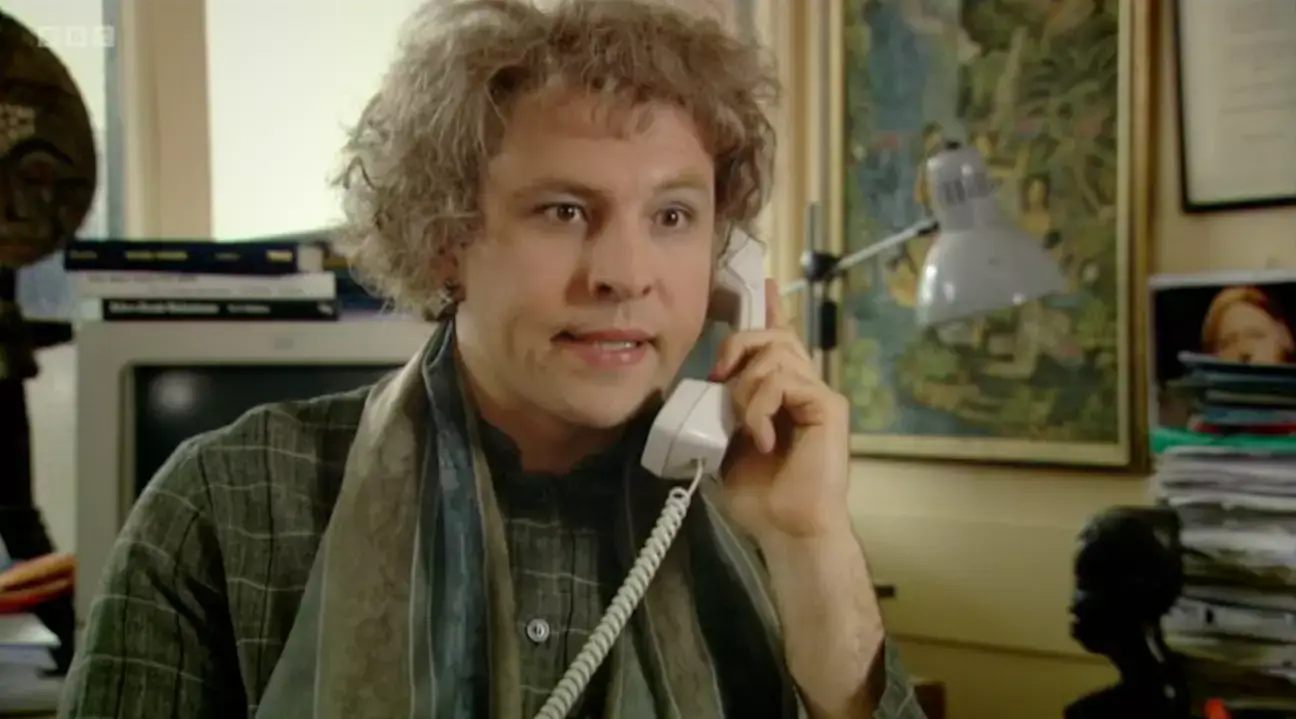 Walliam's character Linda Flint describes a student with derogatory racist terms in the episode.