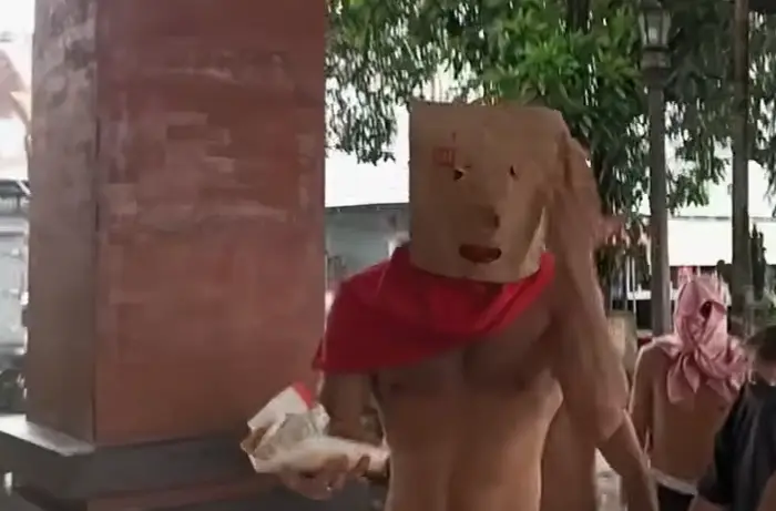 The men detained alongside Bonnie Blue concealed their faces (7 News)