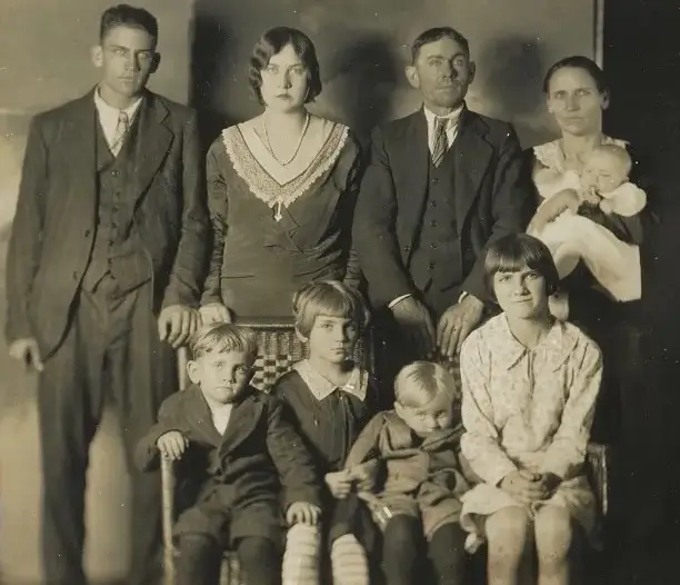 (Top left to right) Arthur (16), Marie (17), Charlie (43), Fannie (37), Mary Lou (3 months old). (Sitting Left to Right) James (4), Mae Bell (7), Raymond (2), Carrie (12) (Fox 8)
