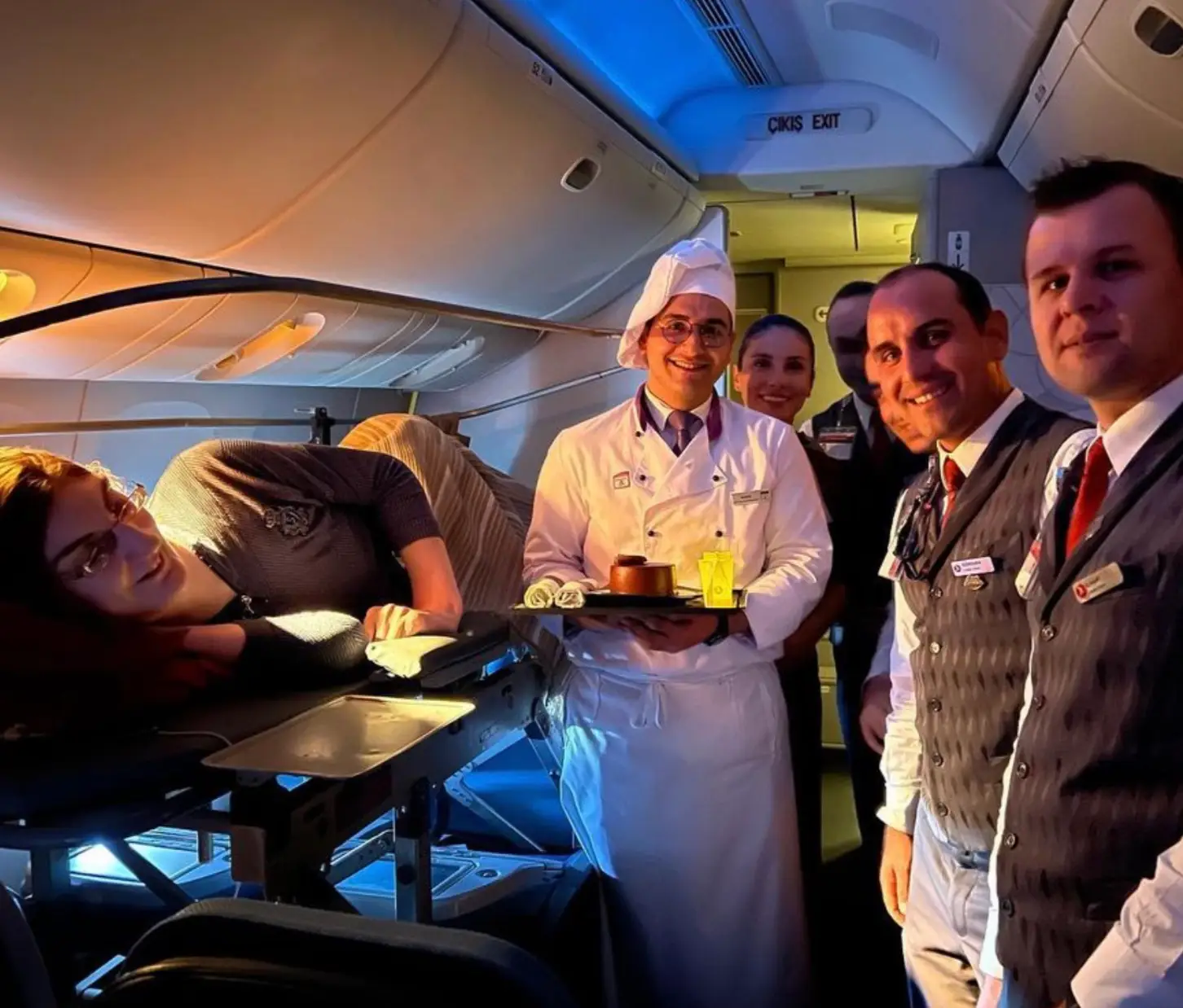 The airline had to remove six rows so she could lie down.