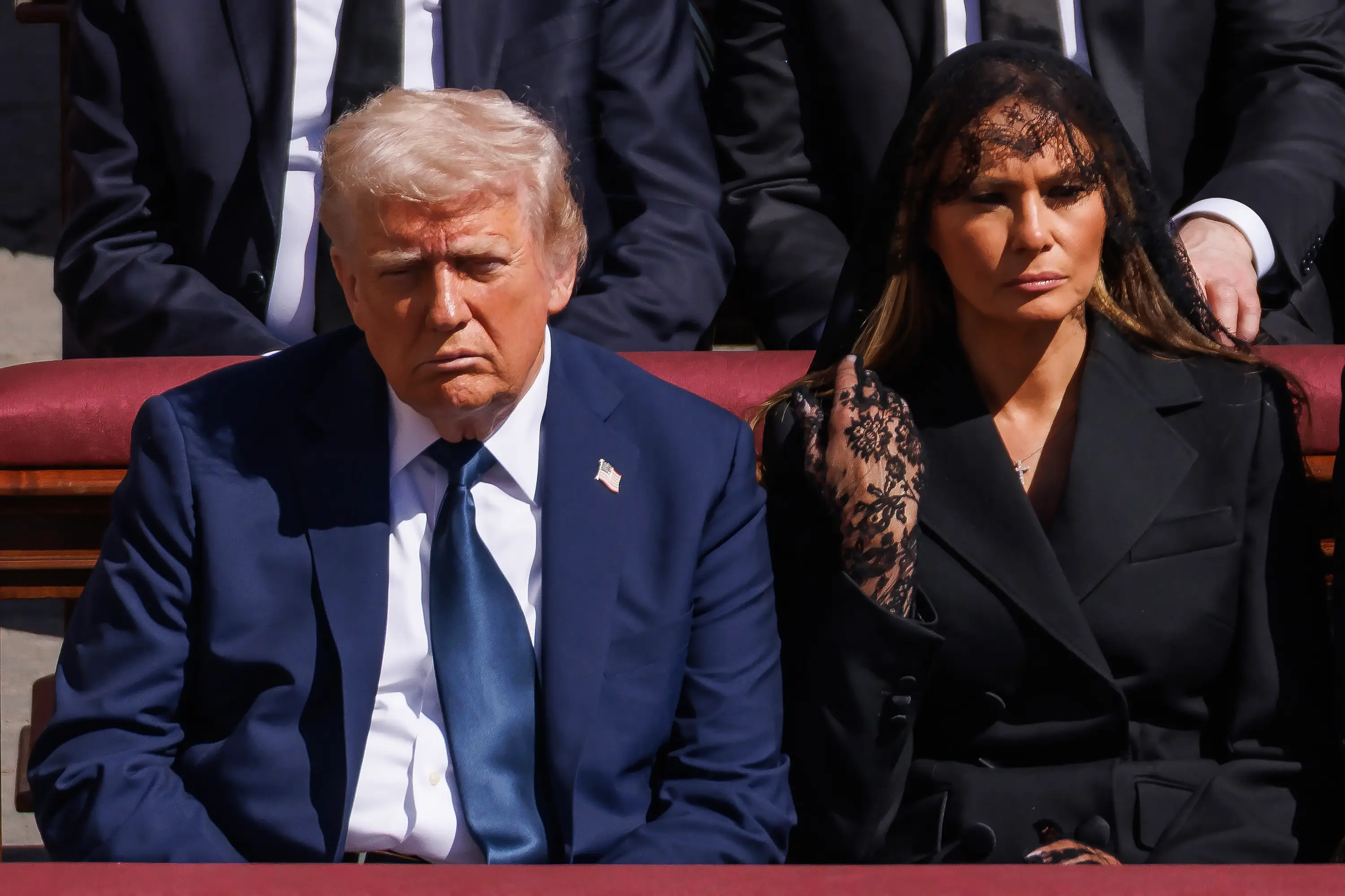 Melania Trump saved the President from an awkward moment during the mass, a lip reader claims (Dan Kitwood/Getty Images)