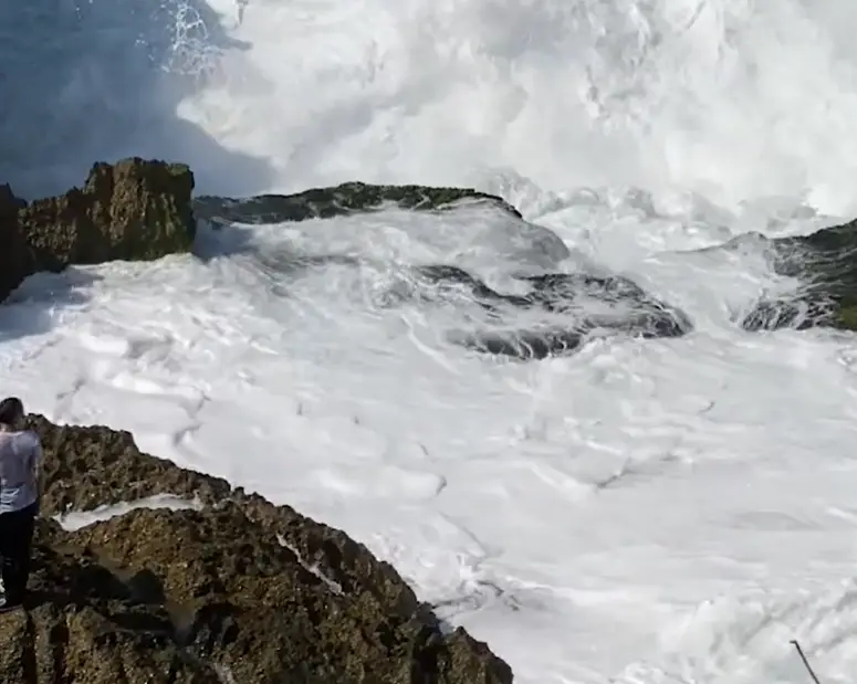 A large wave swept over him and his body is yet to be discovered. (Asia Pacific Press via Viral Press)