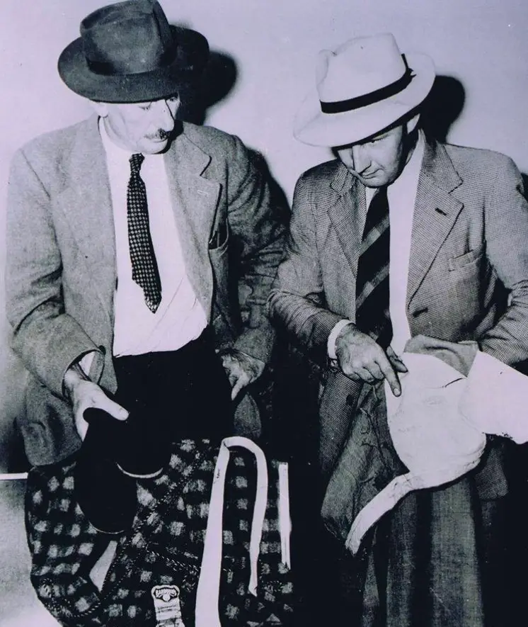 Officers seen trawling through the suitcase which was found a few weeks after the body (Facebook/SouthAustraliaPolice)