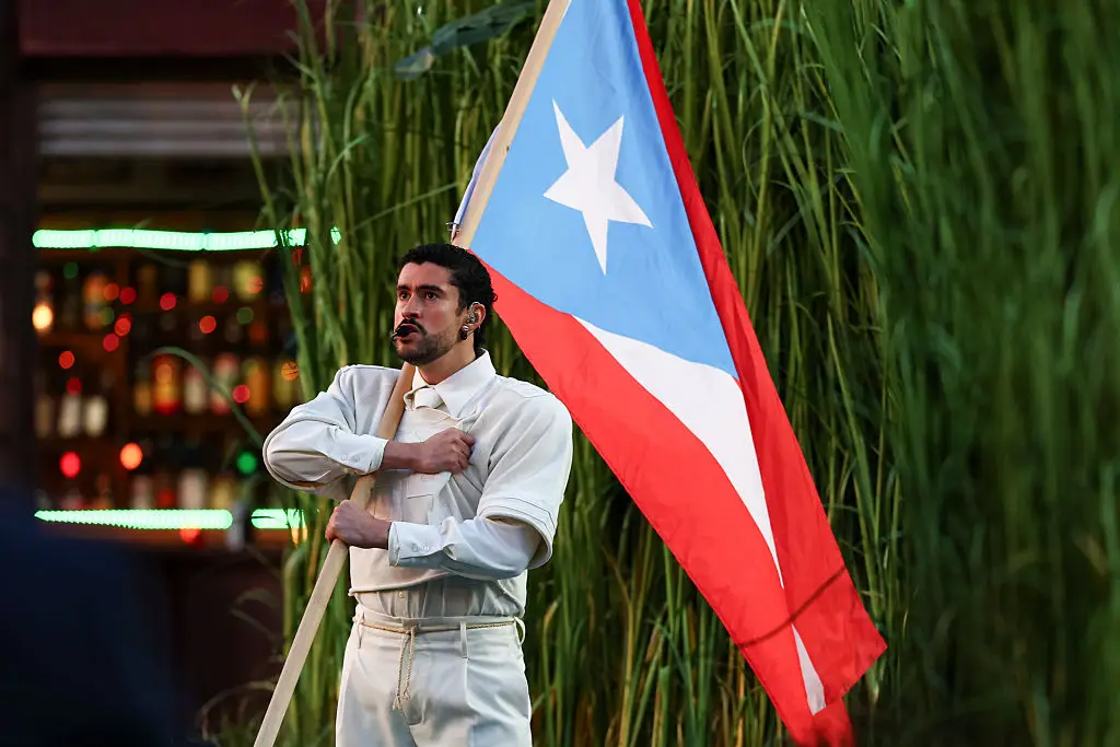 Bad Bunny also held a lighter coloured Puerto Rican flag (Kevin Sabitus/Getty Images)