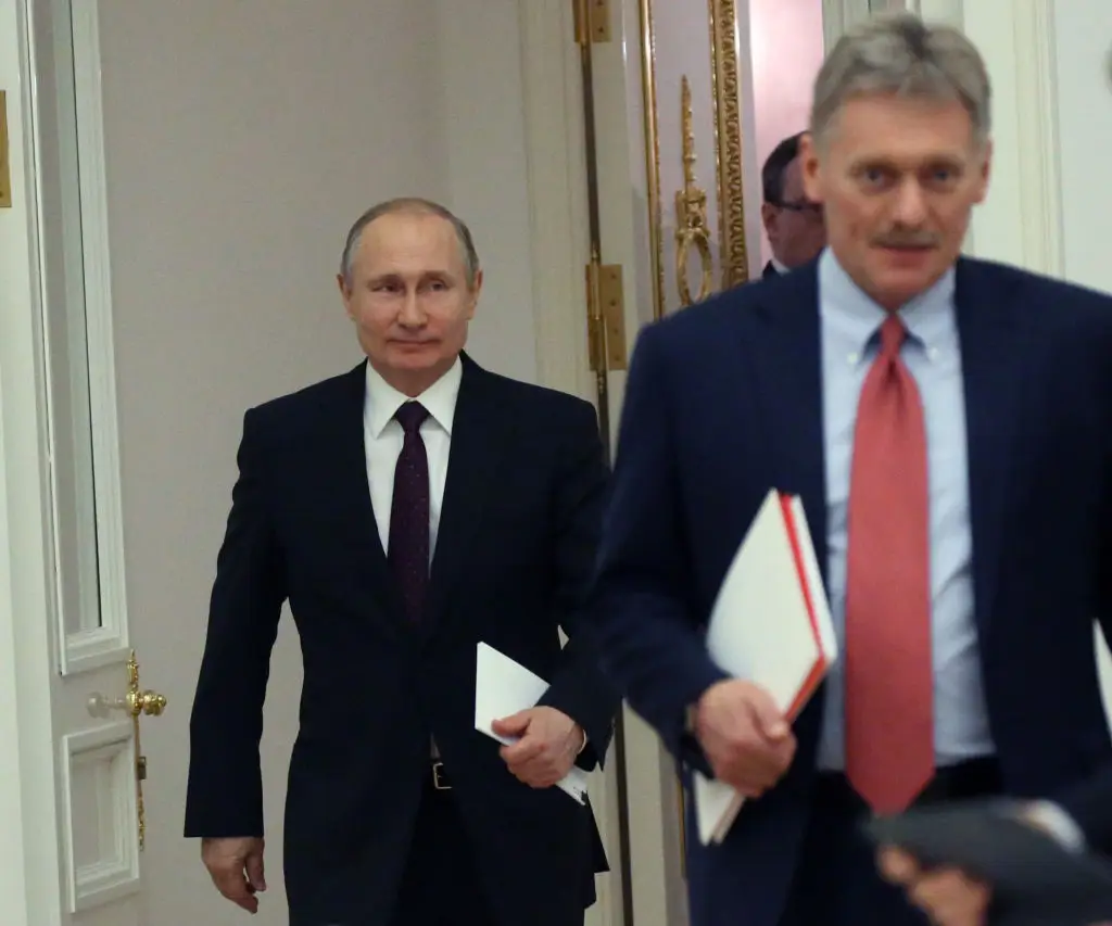 Russian President Vladimir Putin and Kremlin spokesman Dmitry Peskov (Mikhail Svetlov/Getty Images)