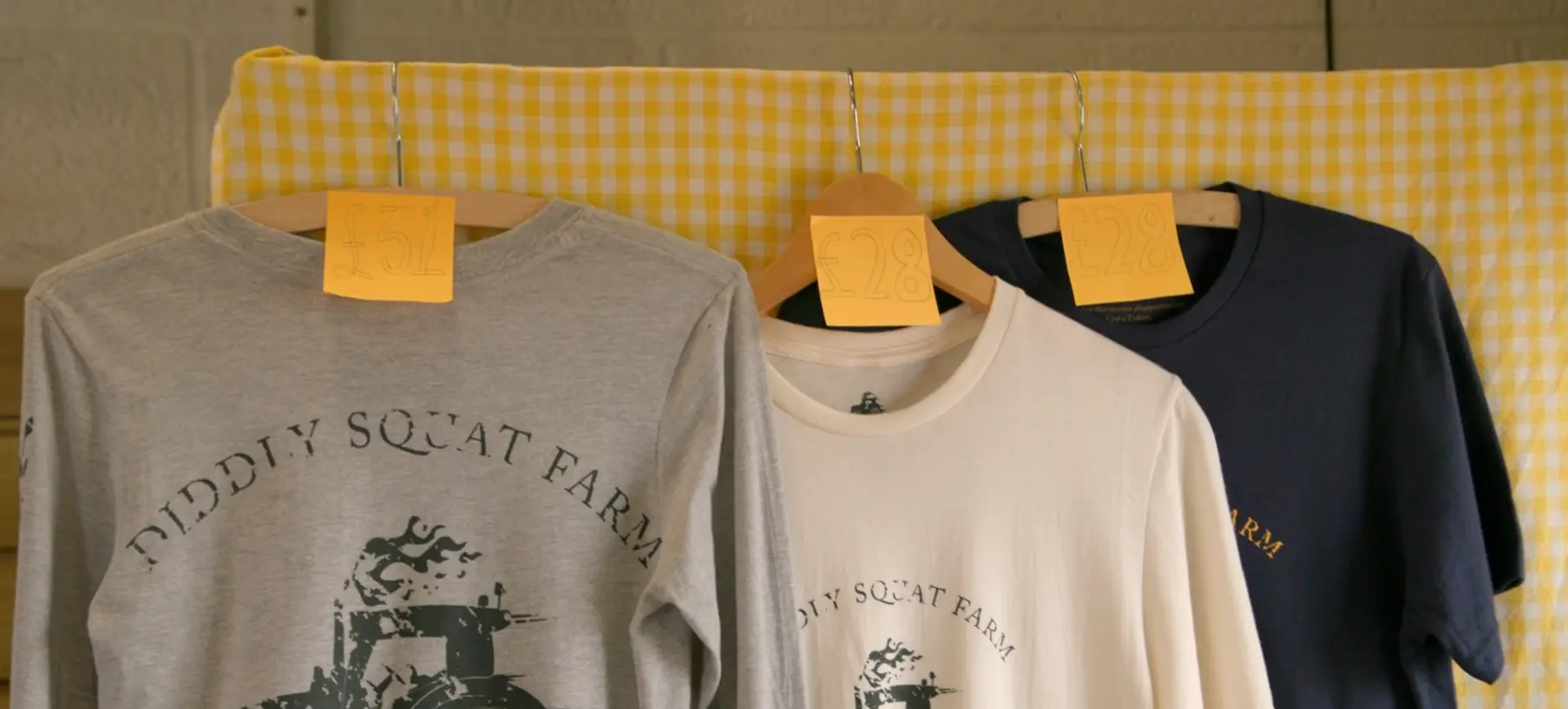 Diddly Squat t-shirts being sold in the farm shop when they can't be. (Prime Video)