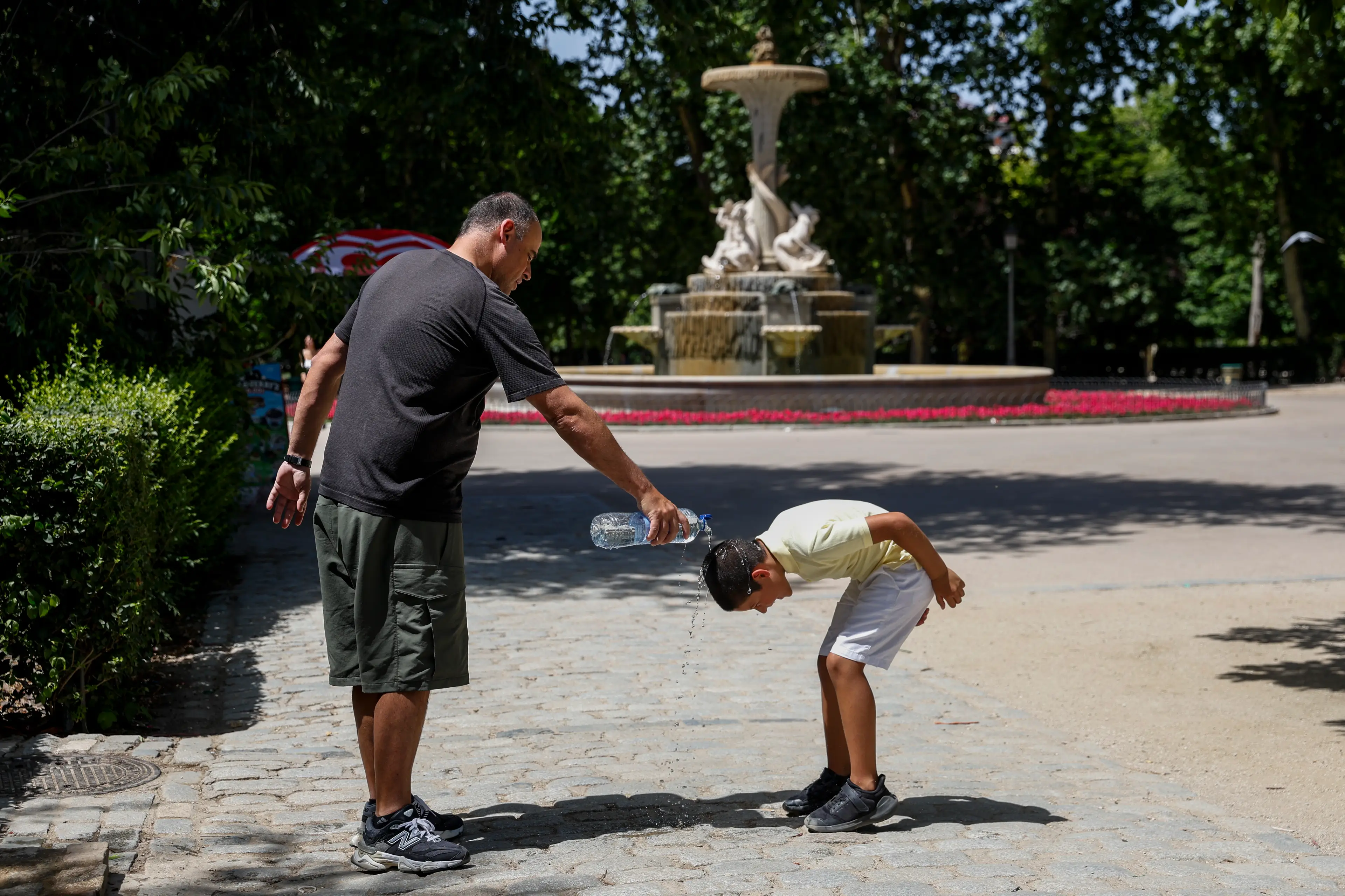 Like this young lad pictured in Madrid, most of us will do anything to cool down during the heatwave (Pablo Blazquez Dominguez/Getty Images)