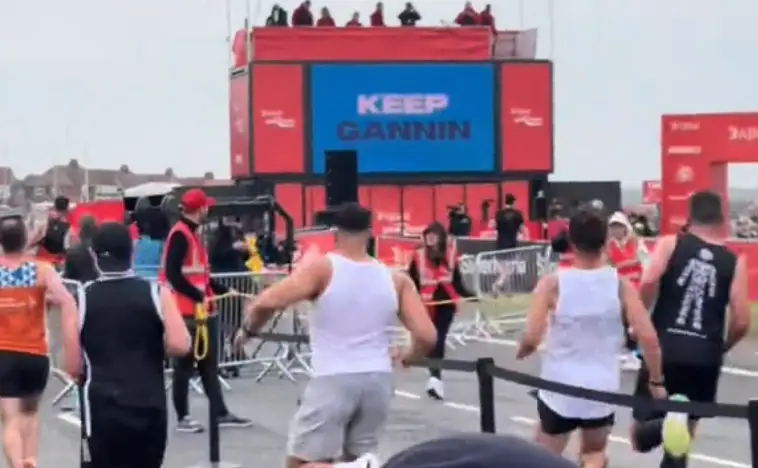 Tommy Fury, pictured in the centre, was spotted doing his signature sprint at the Great North Run (TikTok/@sophieconnor05)