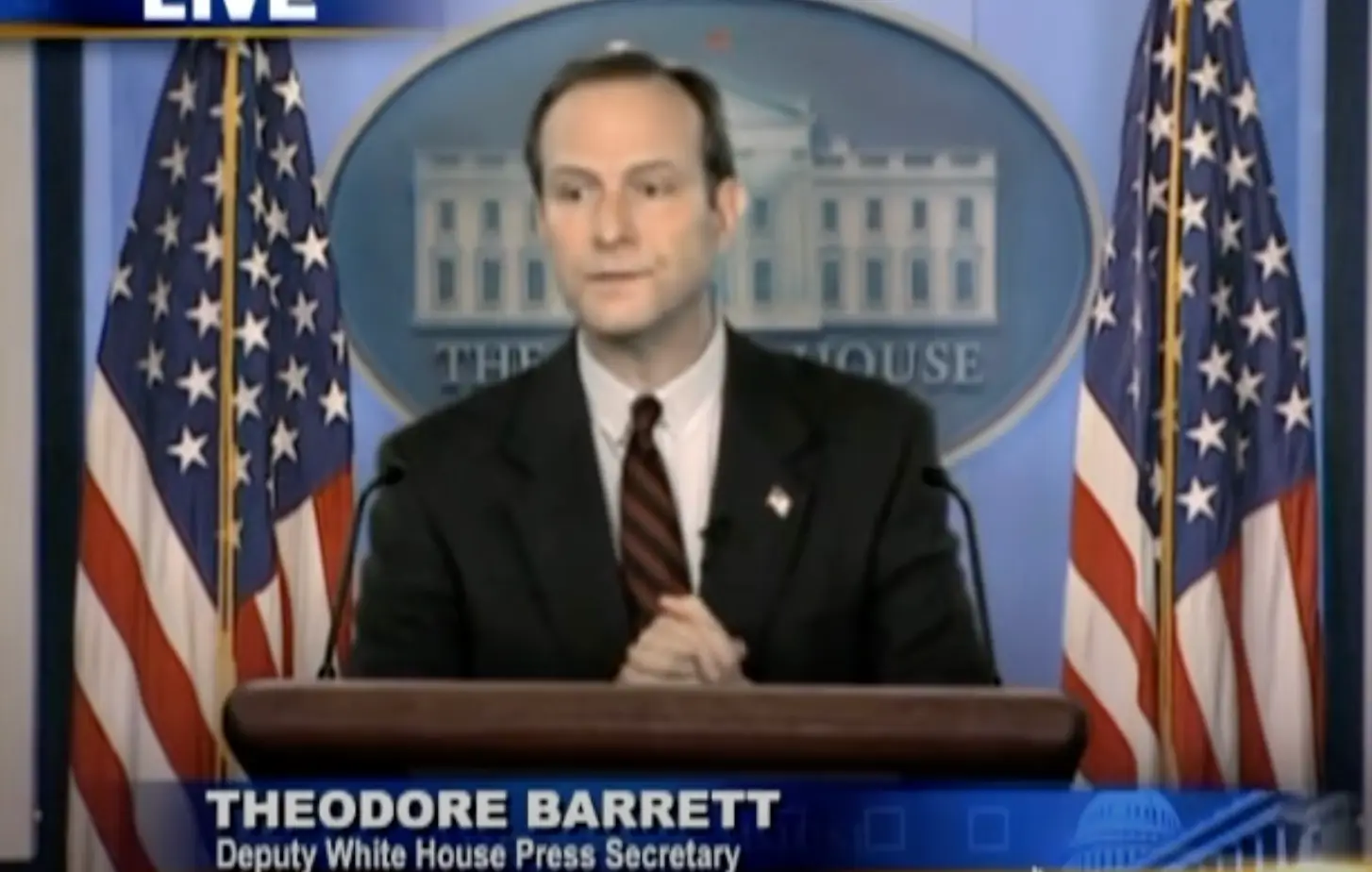 A better question would be, who is the man playing Theodore Barrett? (YouTube/ The Onion)