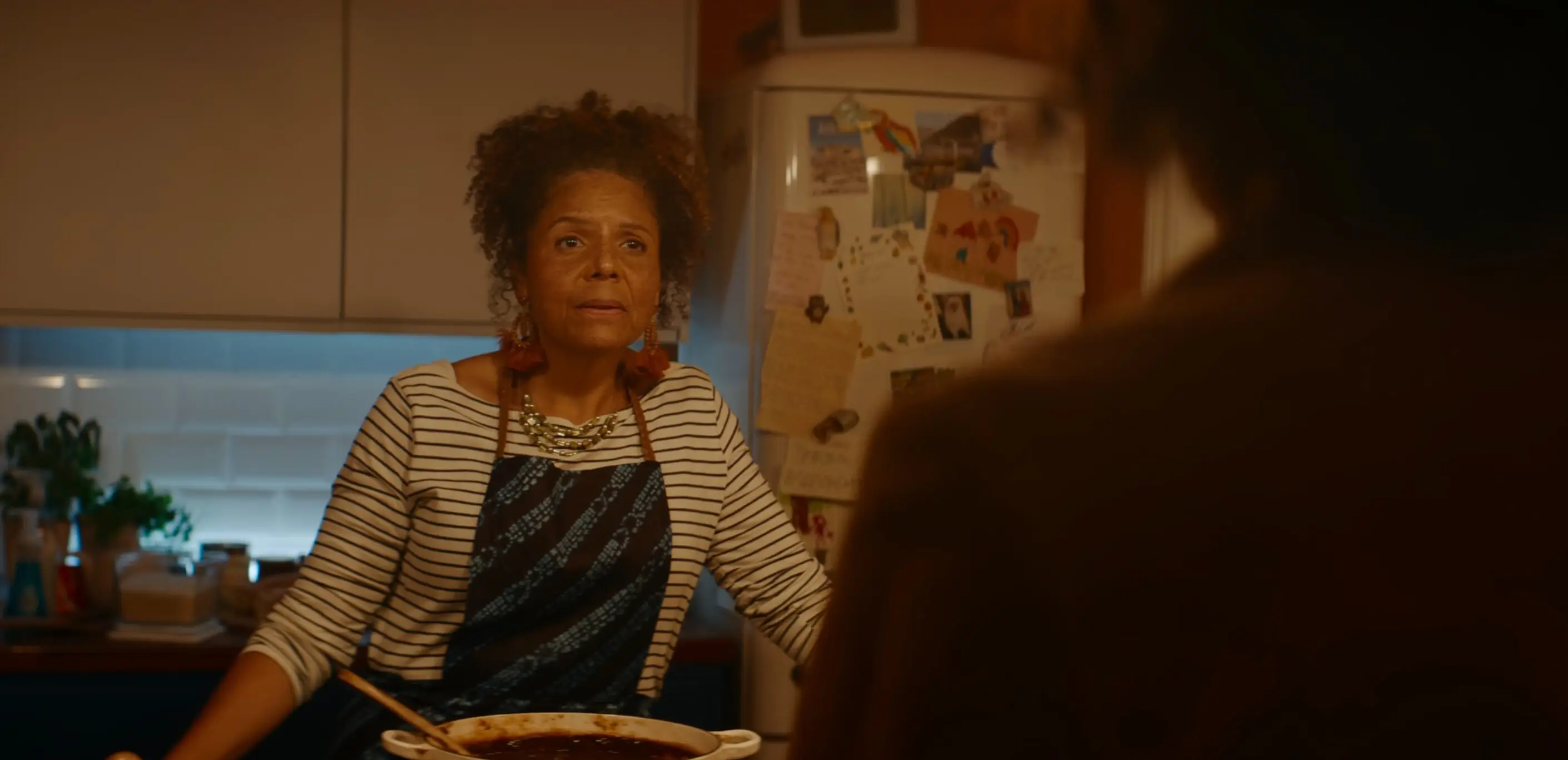 Kat's mother Odette is seen wearing a necklace with three layers at the start of the scene (Netflix)