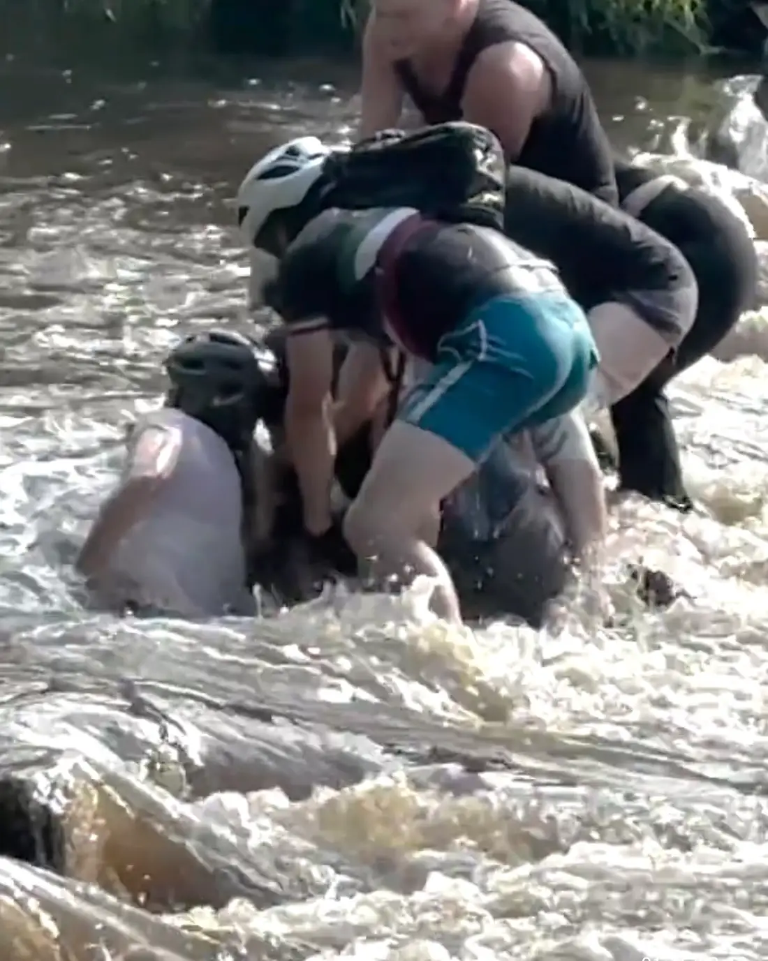 Brave onlookers rushed over to the cyclist to assist her (ABC7 Chicago)