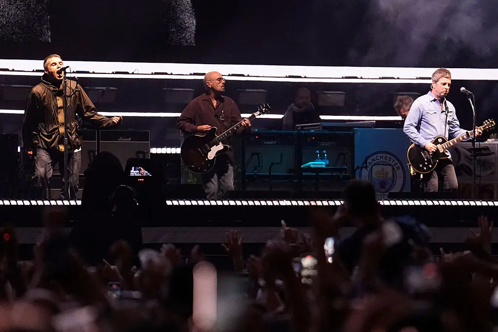 Paul 'Bonehead' Arthurs, centre, received a shoutout from Noel (AFP STRINGER/AFP via Getty Images)