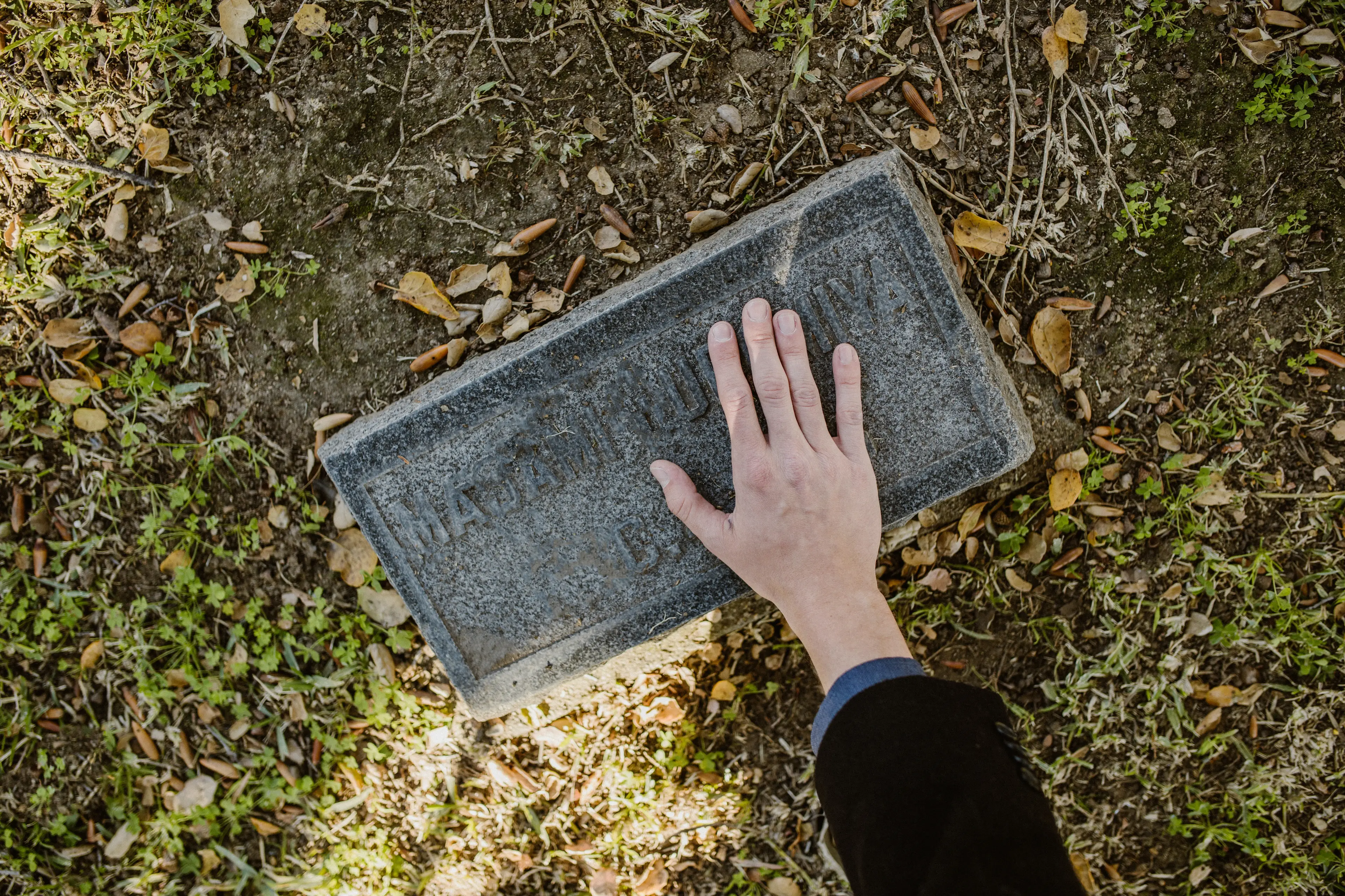 John is going to buy a gravestone for his wife with the prize money.