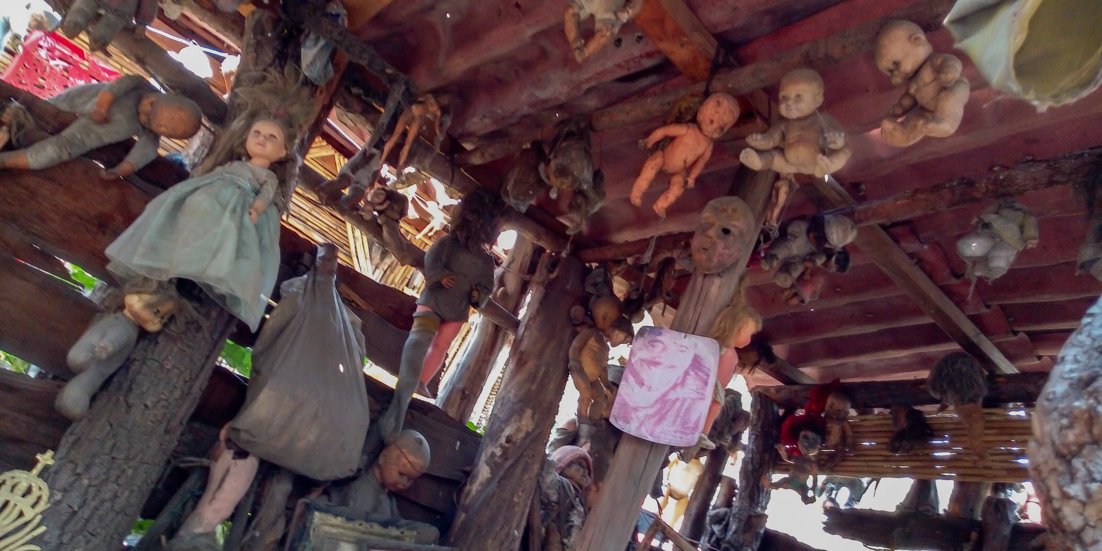 Several dolls seen hanging from a ceiling (Getty Images)