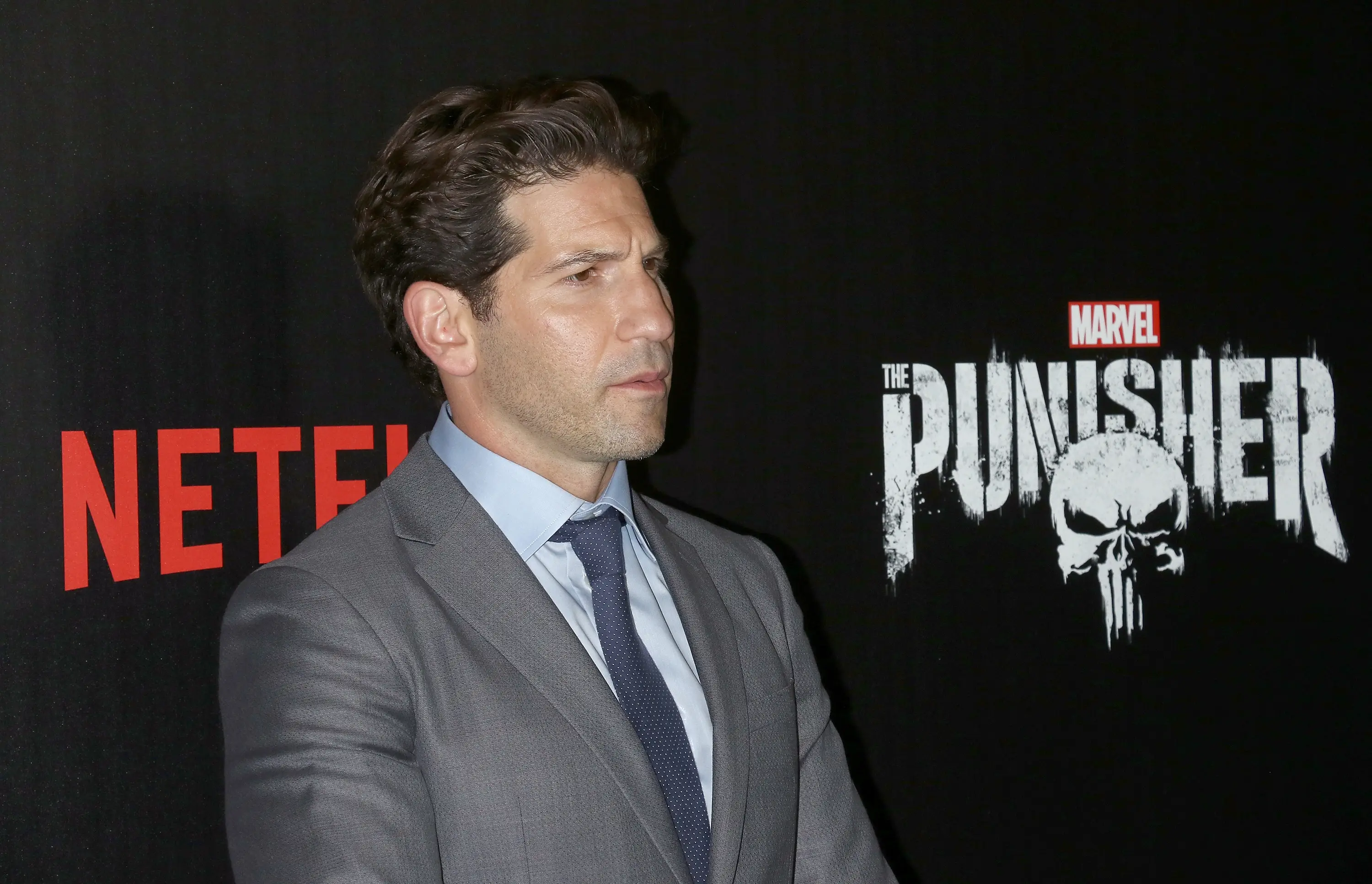 Jon Bernthal stands in front of a Punisher logo (Jim Spellman/WireImage)