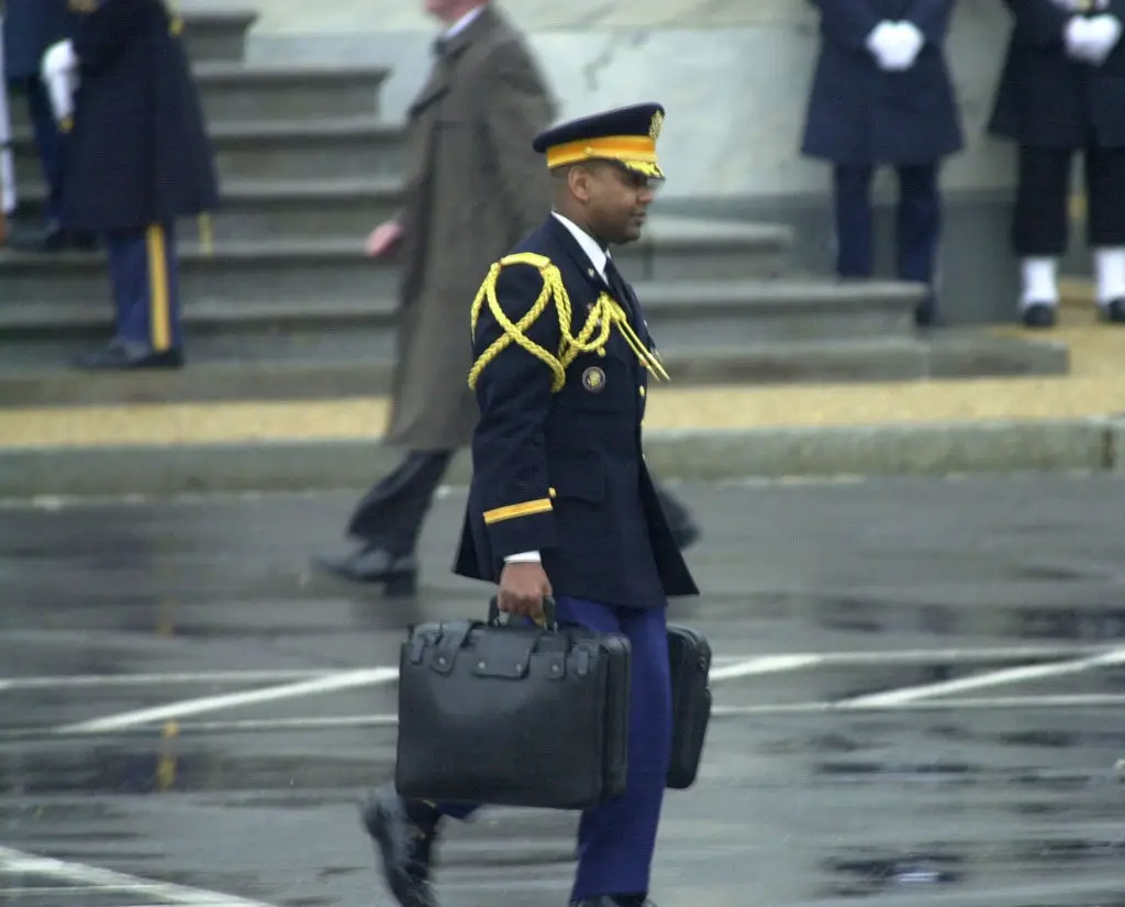 A US military aide carrying 'the Football' in 2001 (Greg Mathieson/Mai/Getty Images)