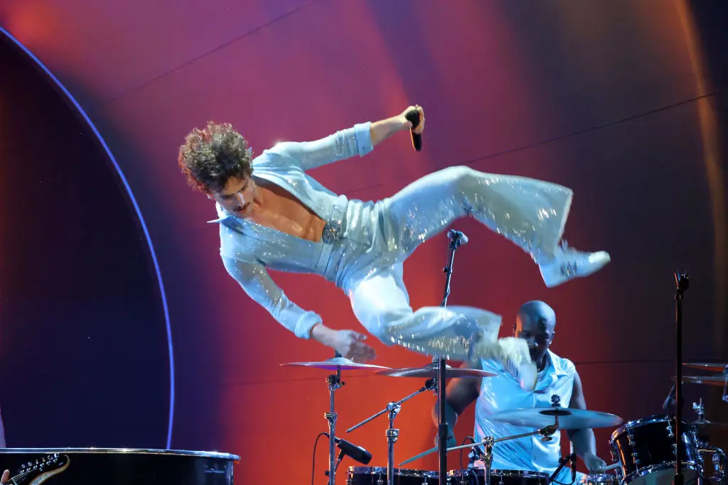 Benson Boone and his skintight jumpsuit performing at the Grammys (Kevin Mazur/Getty Images)