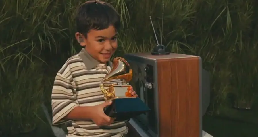 The little boy was handed a Grammy during the halftime show (Channel 5)