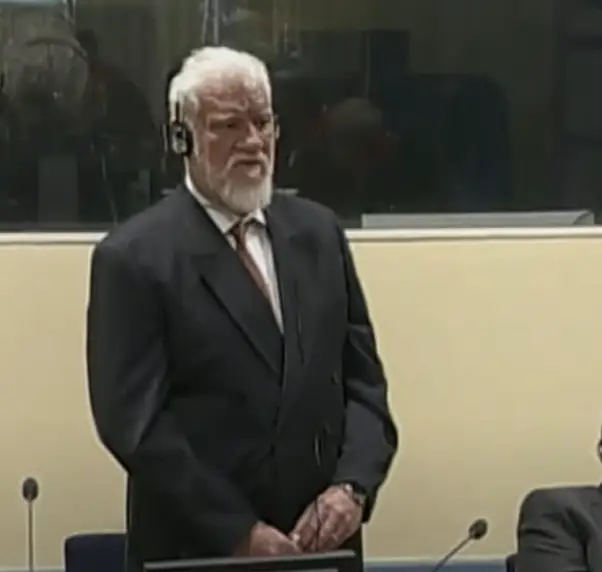 He was fiddling with the bottle in court (YouTube/TRTWorld)