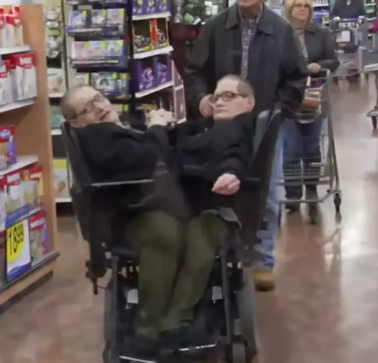 The twins managed to get around in a specially made wheelchair (YouTube/@insideedition)