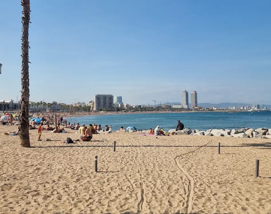 Tourists flock to the beach while abroad.