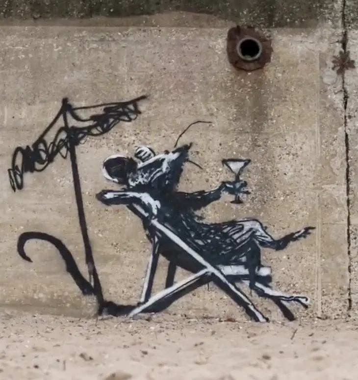 One of Banksy's pieces, which appeared at the bottom of Links Hill in North Beach, Lowestoft, depicts a rat reclining in a deckchair with a cocktail in its hand.