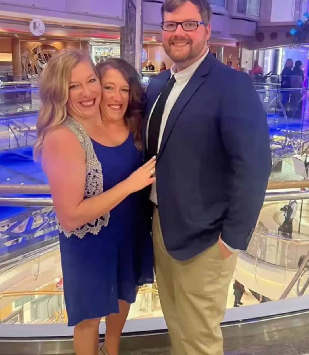 The twins pictured with Abby's husband Joshua Bowling (TikTok/@abbyandbrittanyhensel)