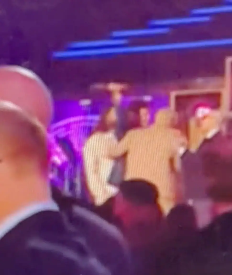 Styles was seen pretending to bonk his producer on the head with his award.