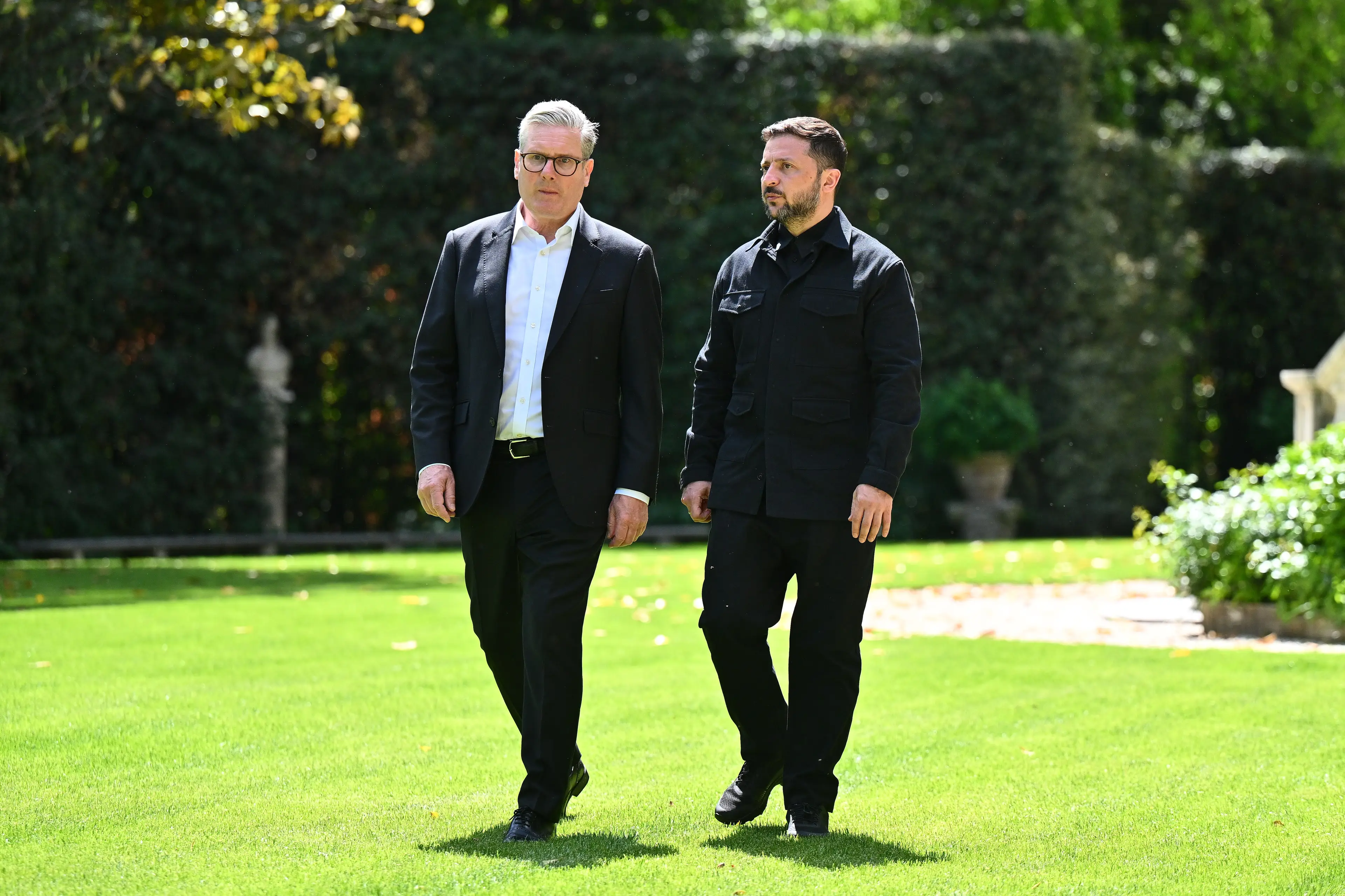 Ukraine's leader, seen with Sir Keir Starmer following the service, wore more casual clobber than most attendees (Marco M. Mantovani/Getty Images)