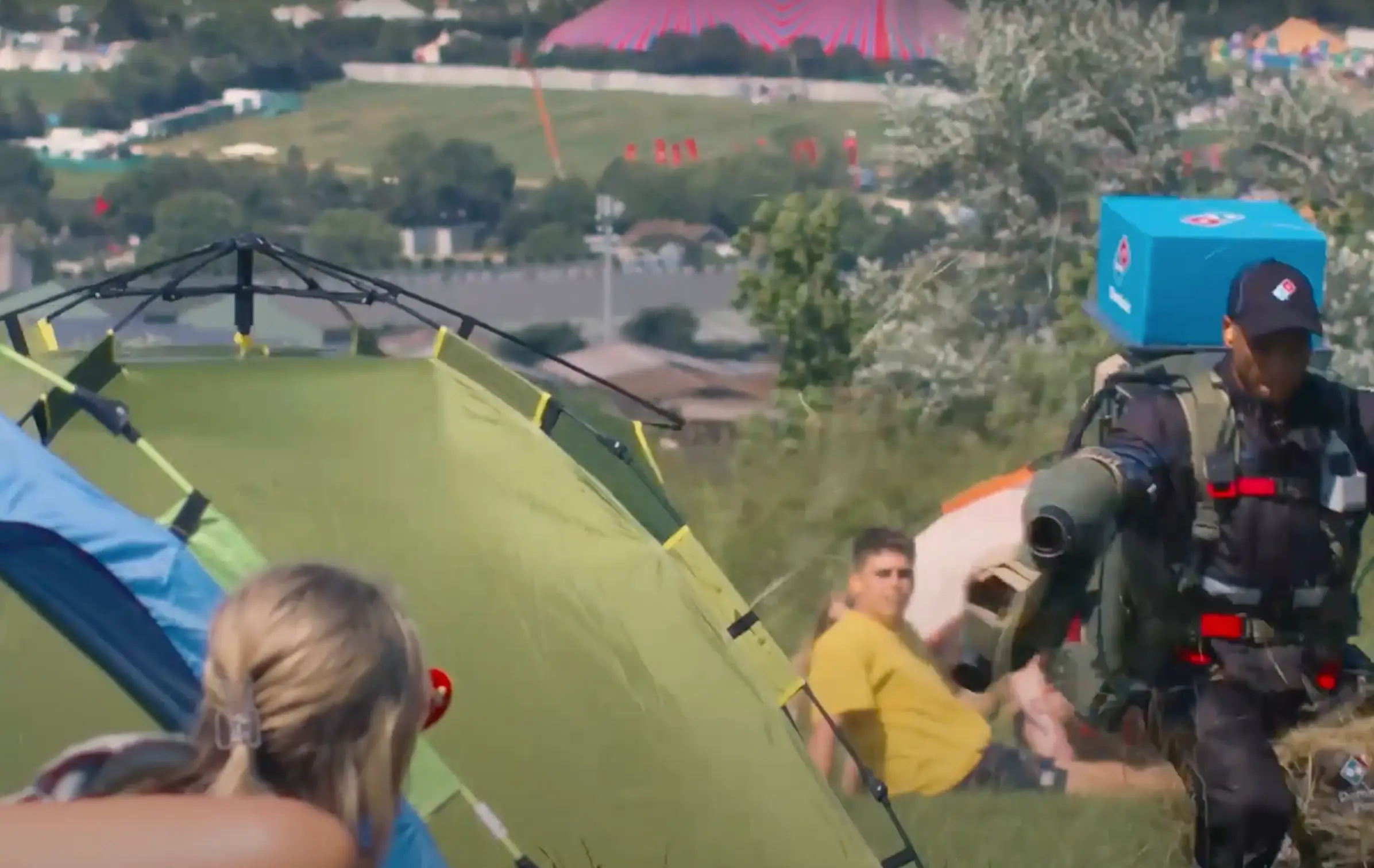 Imaging opening your tent to see a Domino's deliver driver with a jet pack.