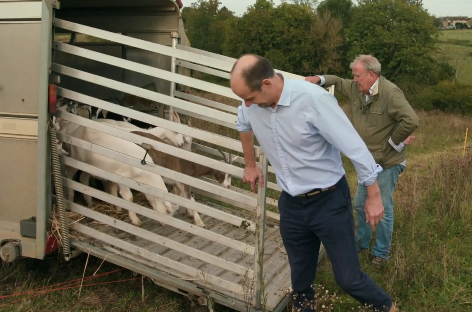 Jeremy and Charlie letting the goats out on to Clarkson's neighbour's land (Prime Video)