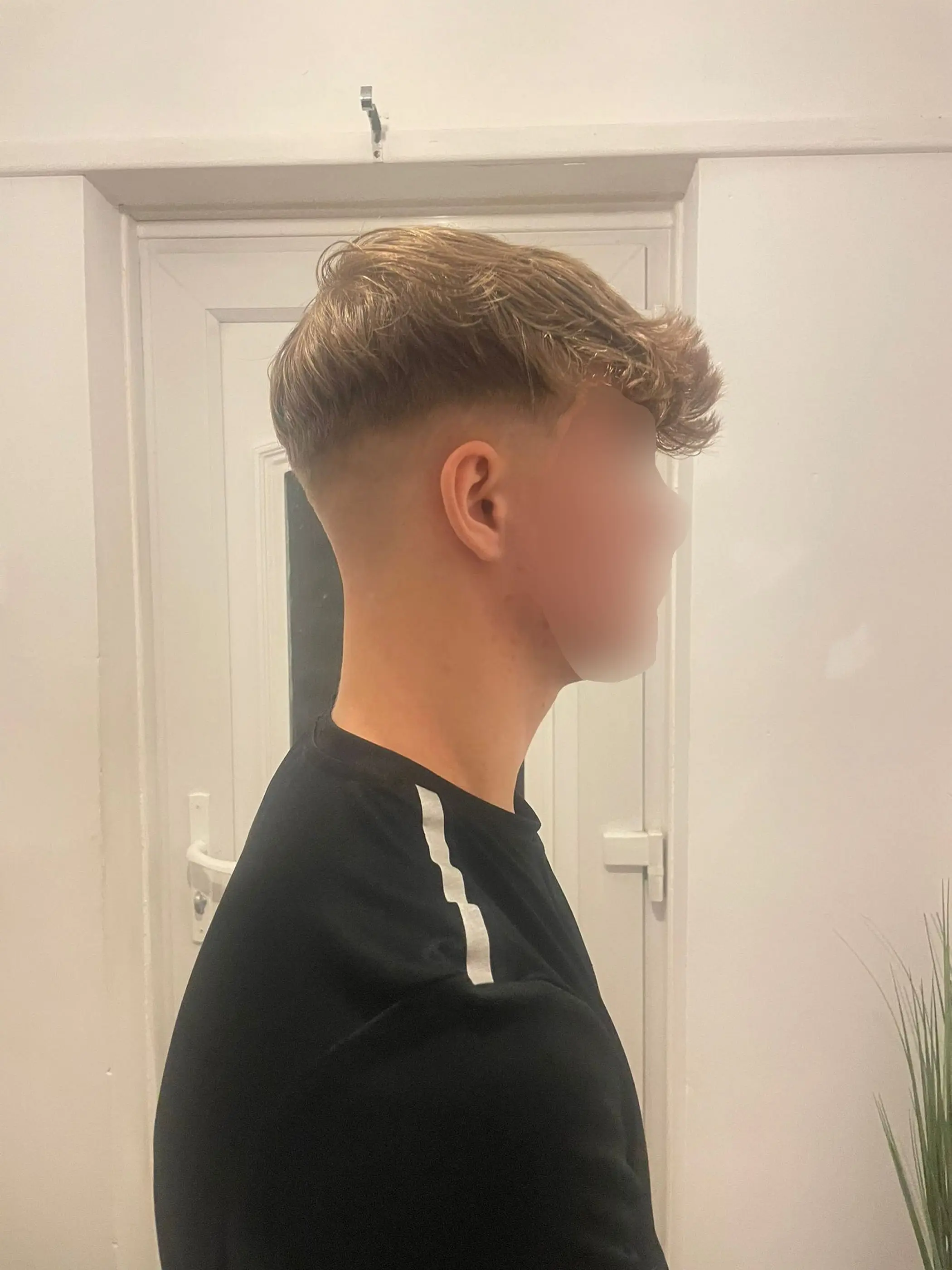 15-year-old Liam got a skin fade haircut and was punished by his school for it. (SWNS)