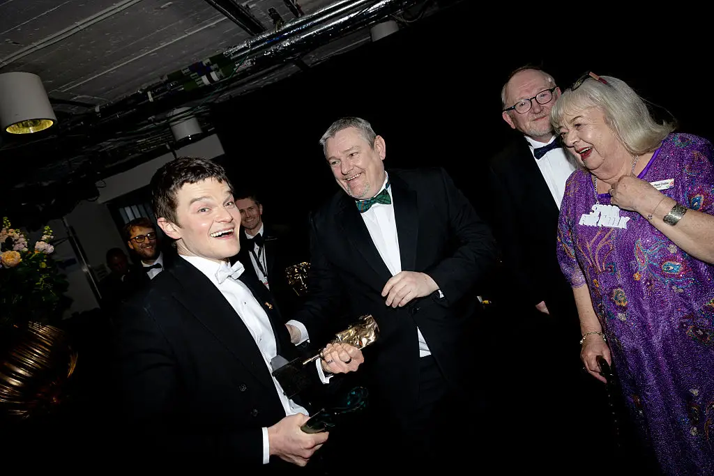 John Davidson and Robert Aramayo, pictured with Dottie Achenbach (Carlo Paloni/BAFTA via Getty Images)