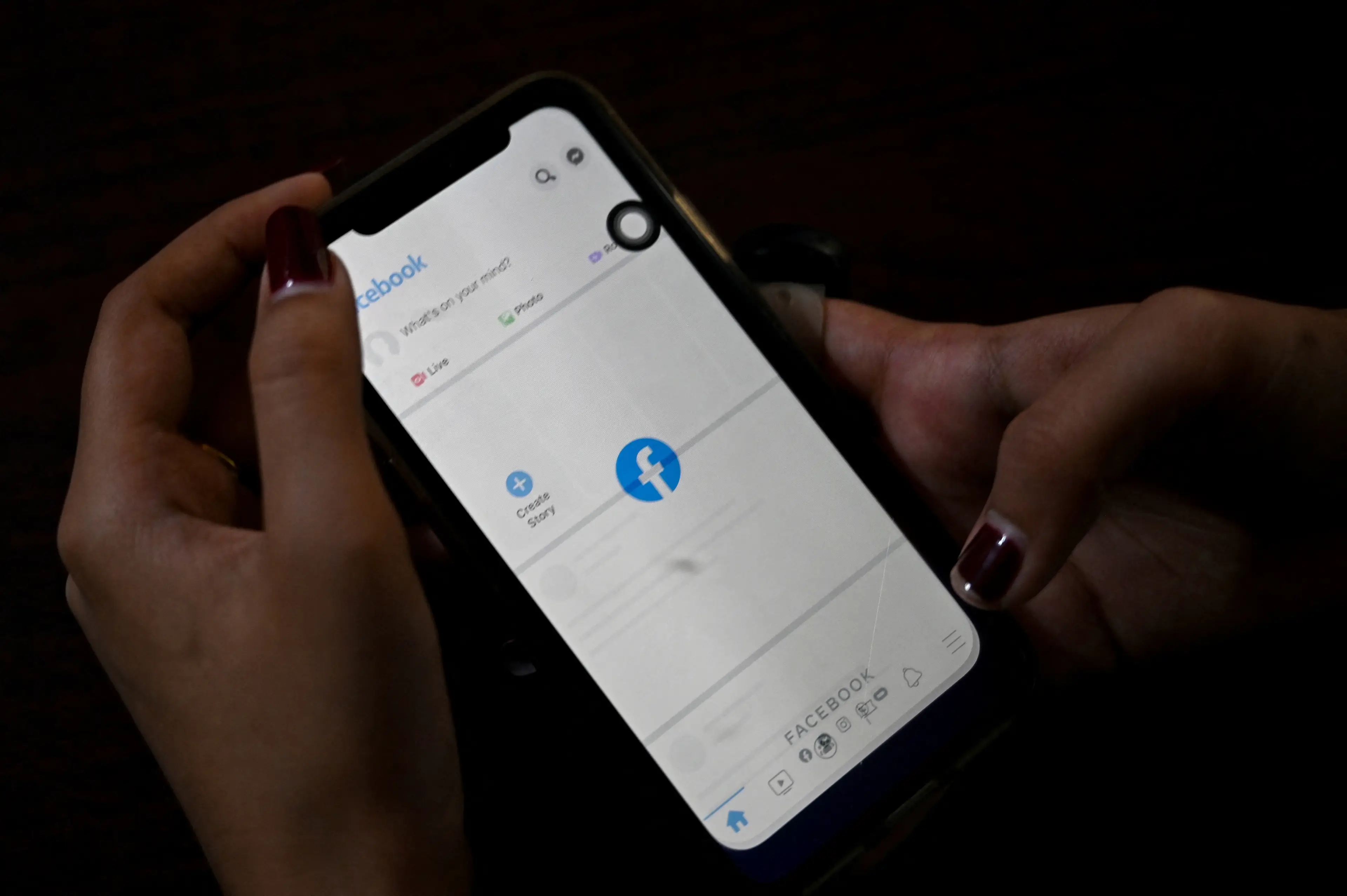 A serial fraudster was uncovered thanks to Facebook (STR/AFP via Getty Images)