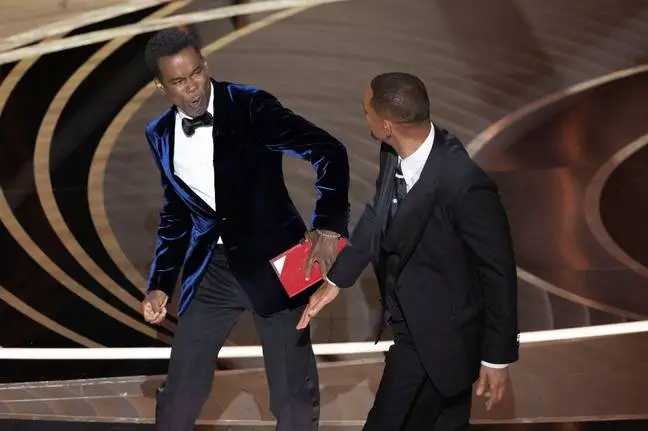 Will Smith slapping Chris Rock.