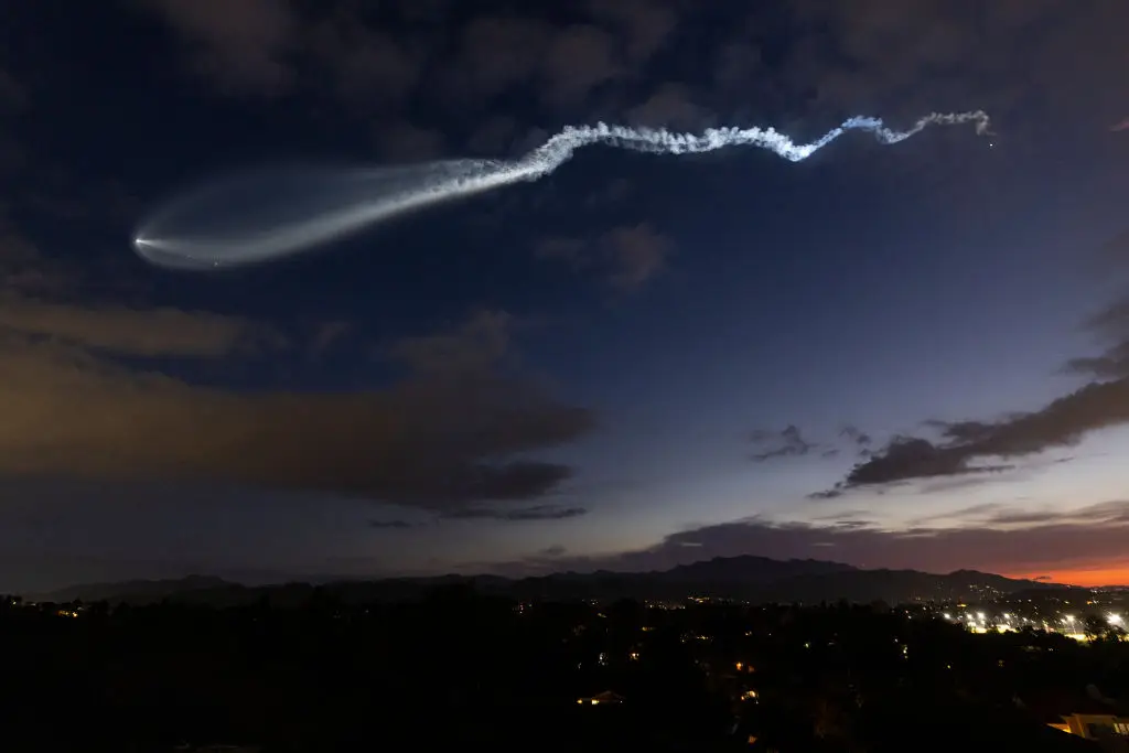 A Falcon 9 rocket launching the satellites into the sky (Kevin Carter/Getty Images)