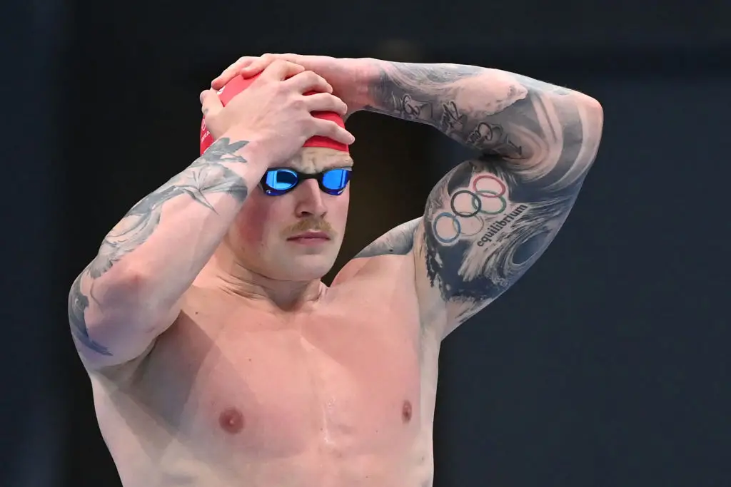 Many Olympians bare the Olympic rings tattoo, including British swimmer Adam Peaty. (ATTILA KISBENEDEK/AFP via Getty Images)