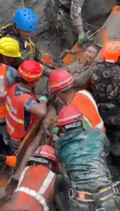 The men, who were covered in mud, are said to be in a stable condition (Nepal Electricity Authority)