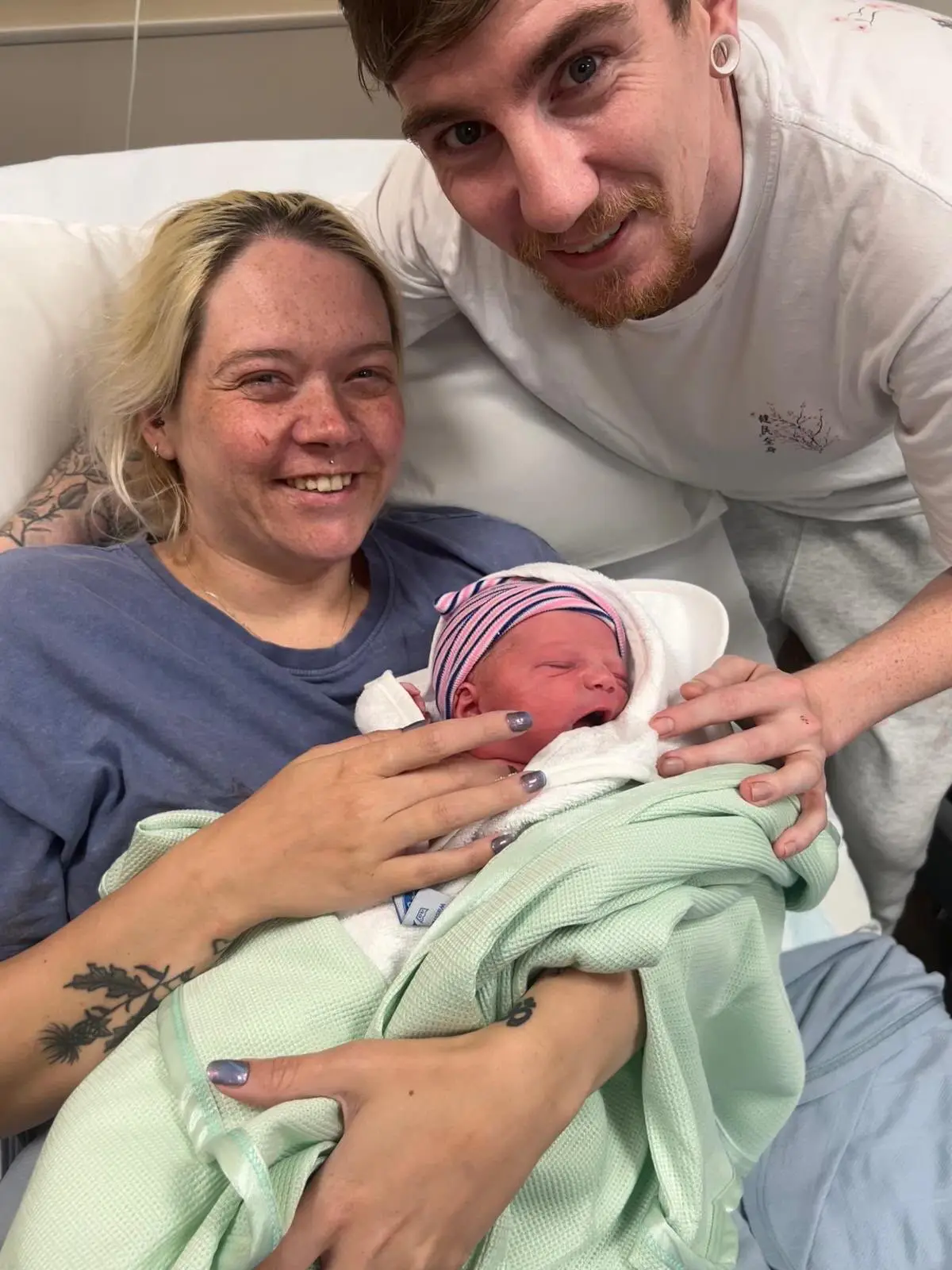 The couple with their baby son Cody (SWNS)