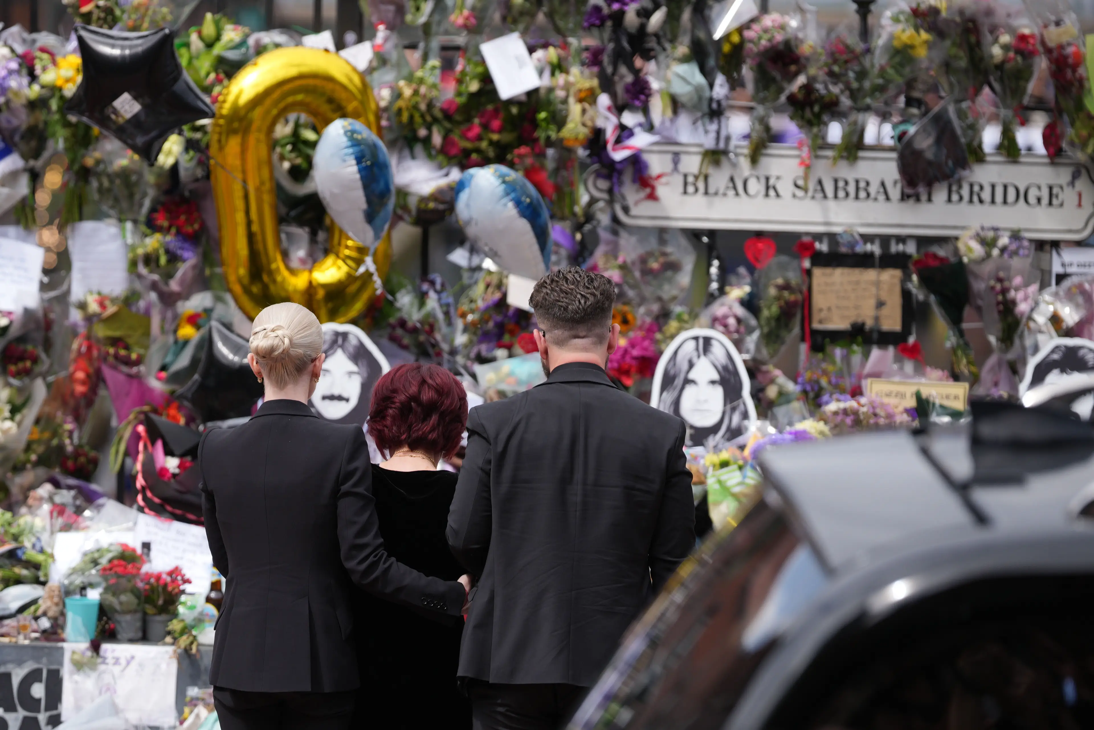 The family visited tributes at Black Sabbath bridge and bench (Christopher Furlong/Getty Images)