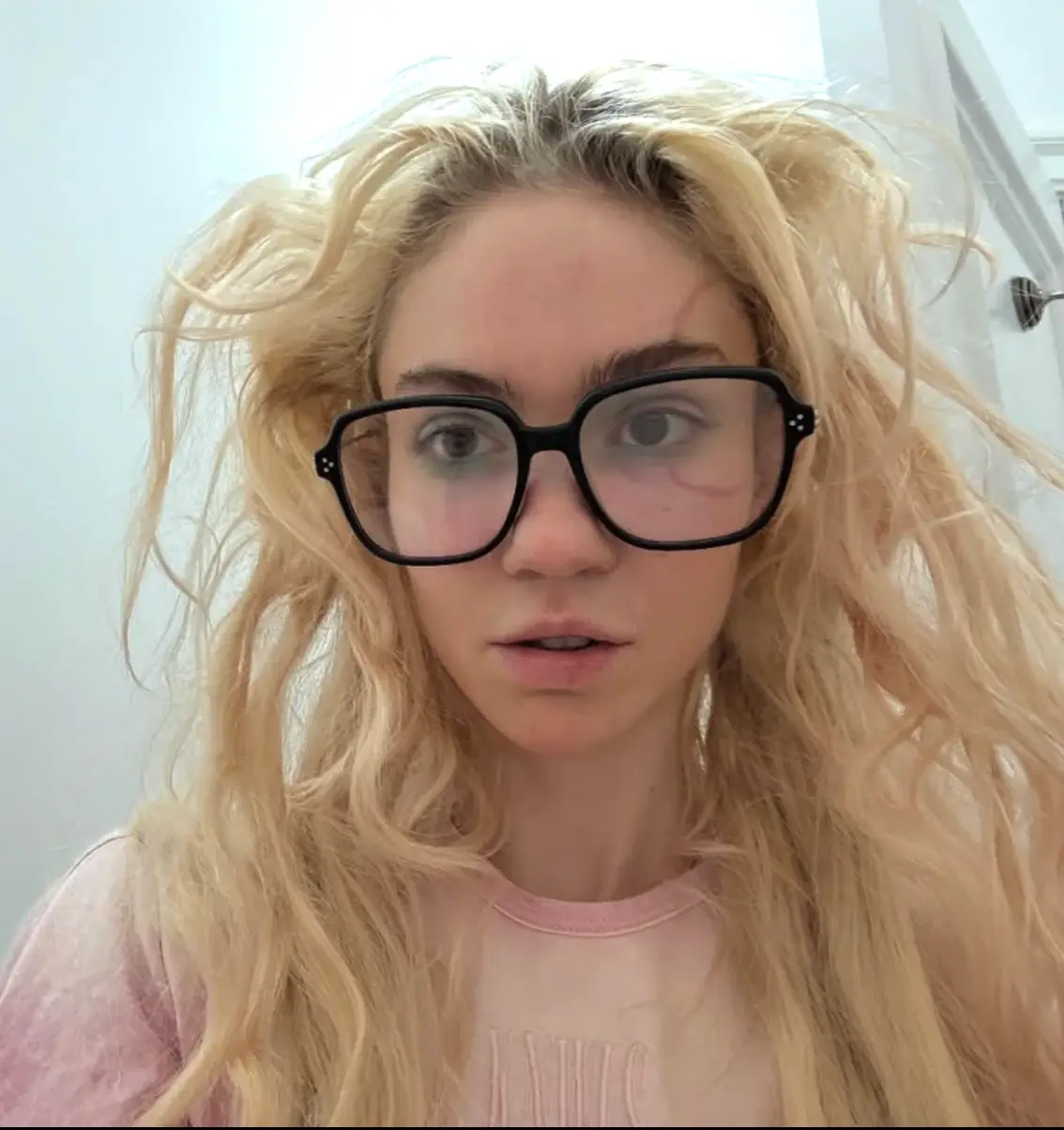 The tattoo the the 'ringworm' shape design which loops around her left eye (Instagram/Grimes)