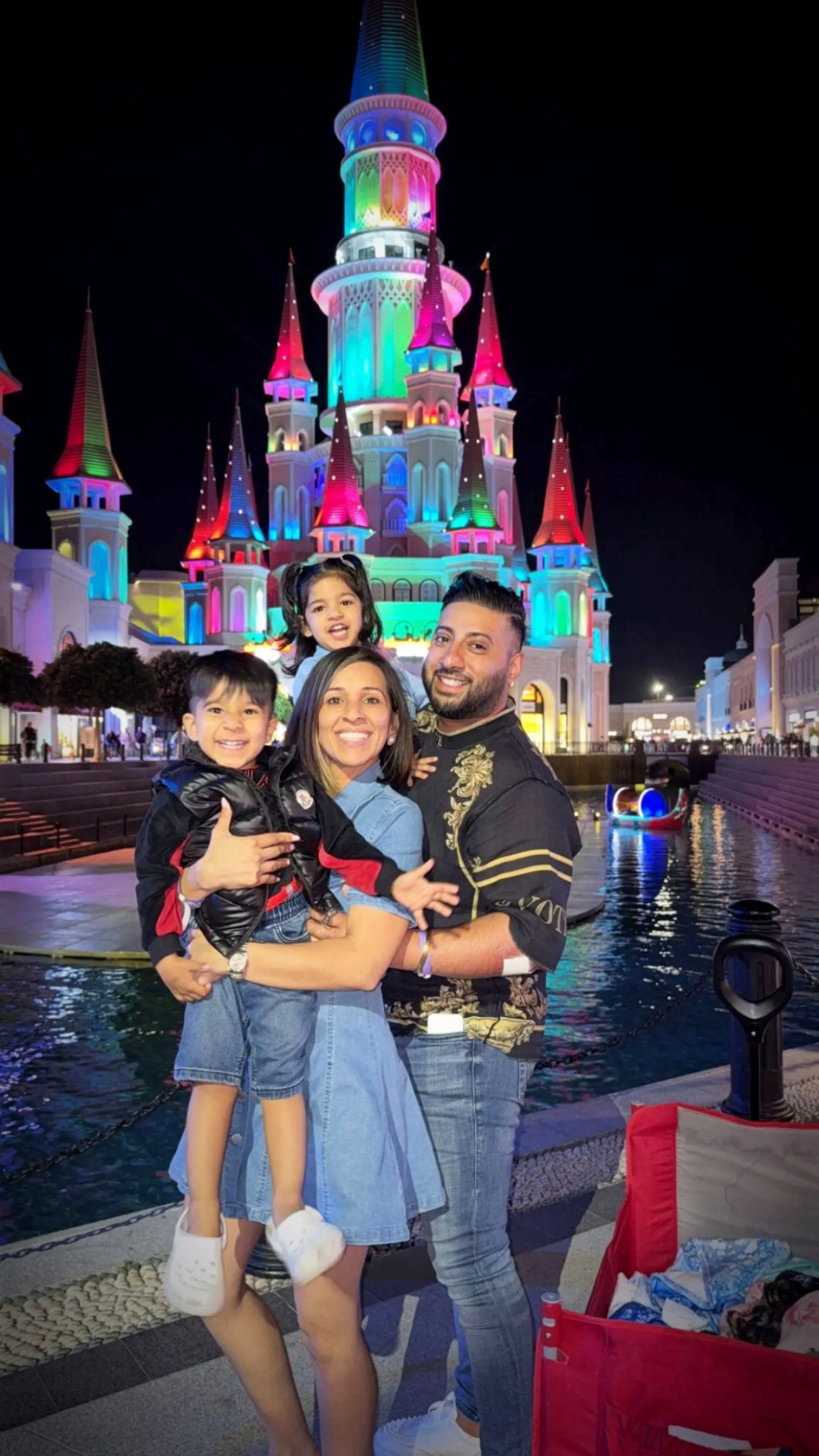 Genie and Ronni on holiday with their two kids (SWNS)