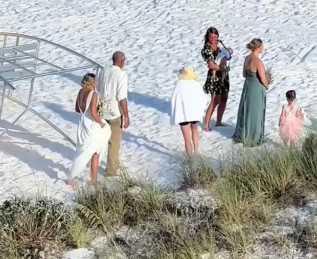 The woman in the yellow hat appeared none the wiser as to what was going on.