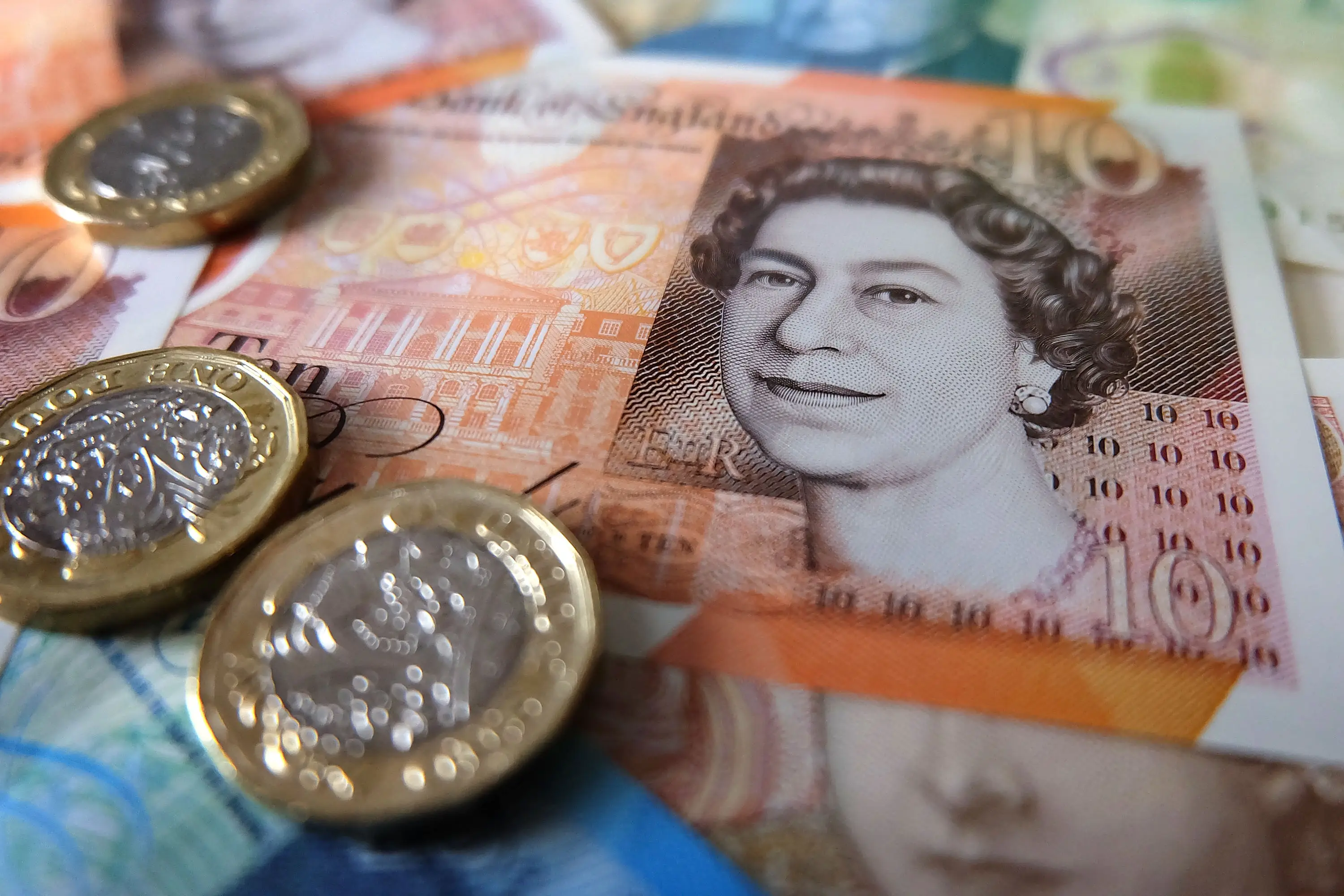 A £10 note and coins. Jim Dyson/Getty Images