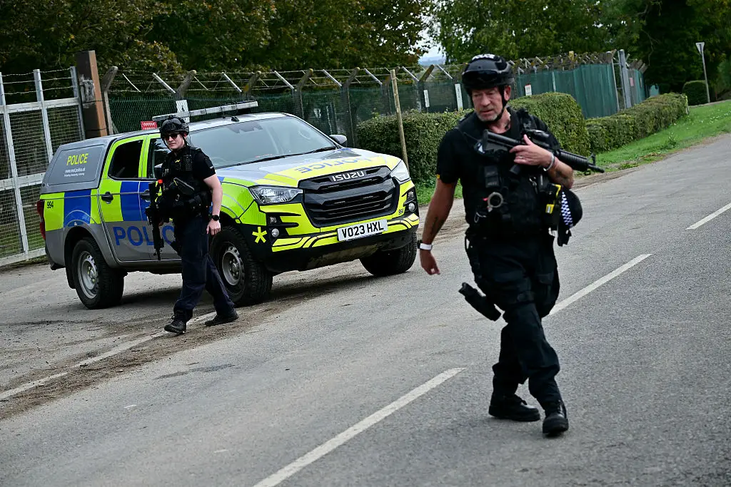 Armed officers surrounded the base (Ben STANSALL / AFP via Getty Images)