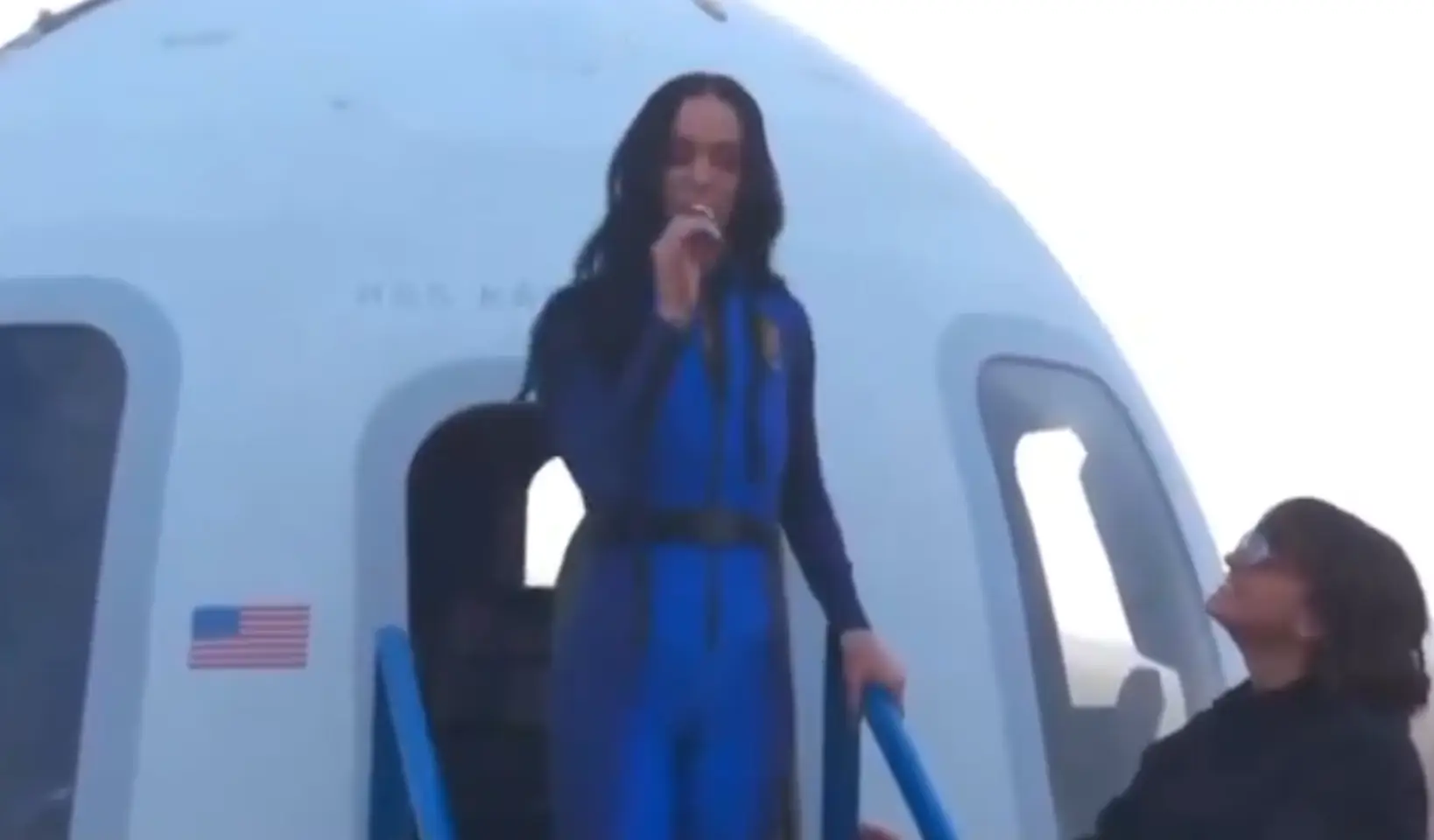 Katy Perry kissed a daisy after returning to Earth (YouTube/Blue Origin)