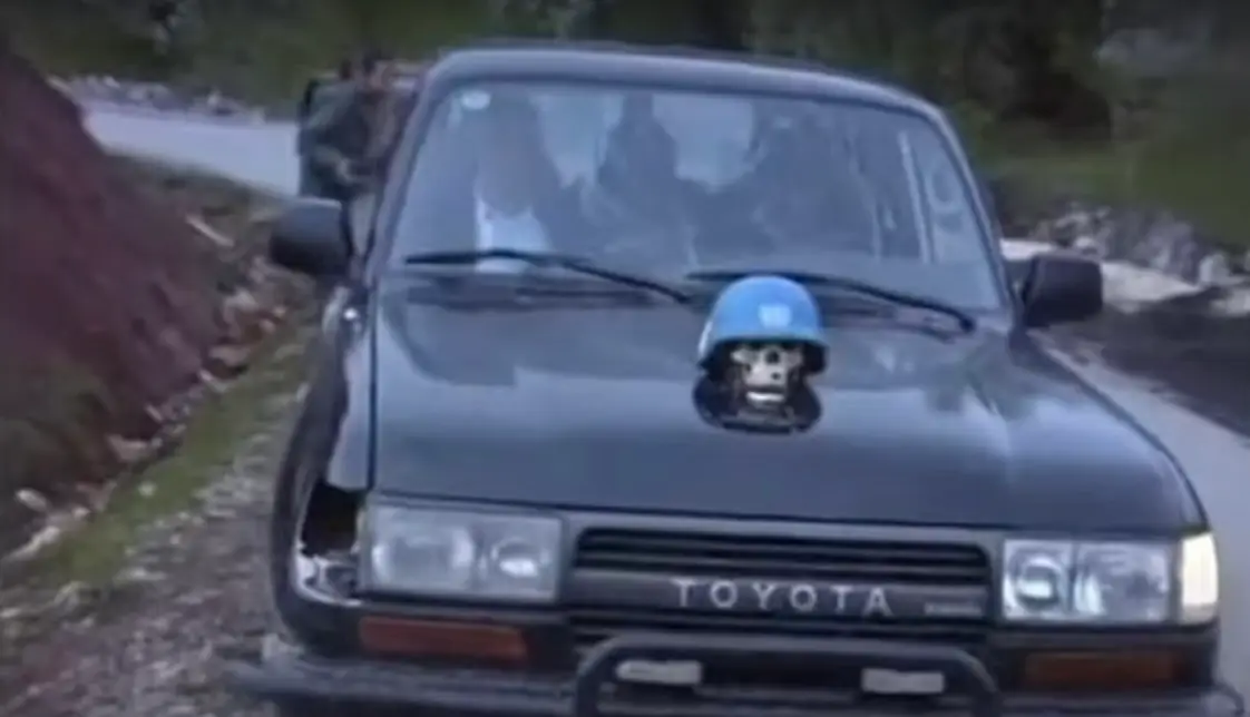 The car that the former militia leader is alleged to have driven around (X)