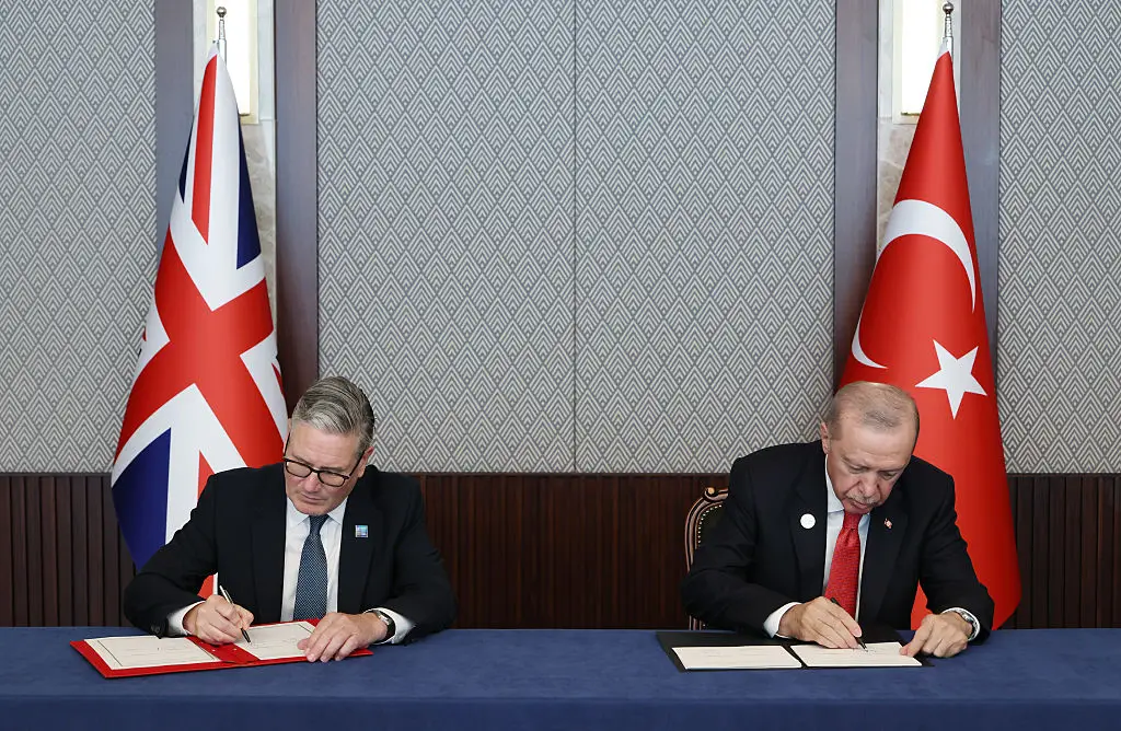 Starmer and Erdogan at the NATO summit. (Turkish Presidency / Murat Cetinmuhurdar / Handout/Anadolu via Getty Images)