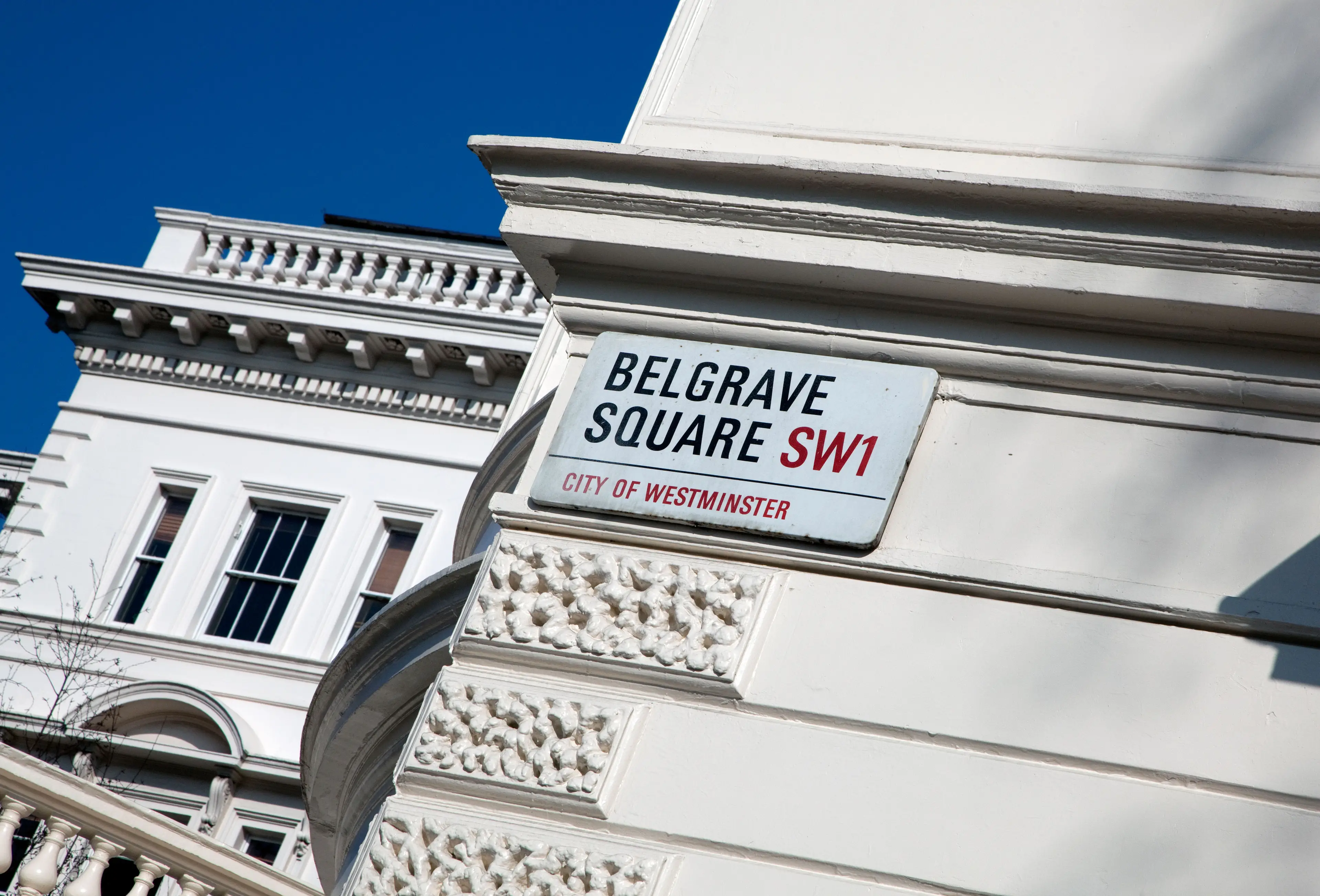 A London mansion owned by a Russian oligarch has been overtaken by squatters armed with banners and a Ukrainian flag.